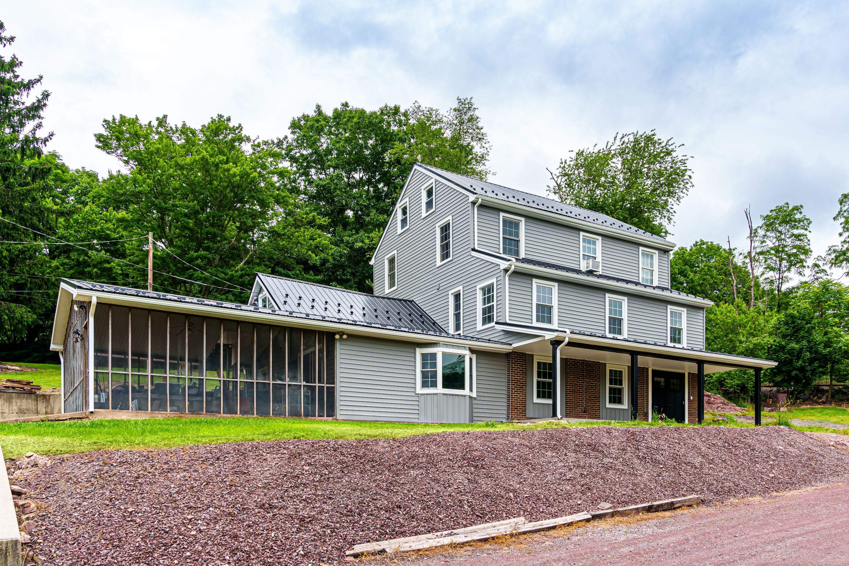 New Metal roof and New siding by Esh Builders