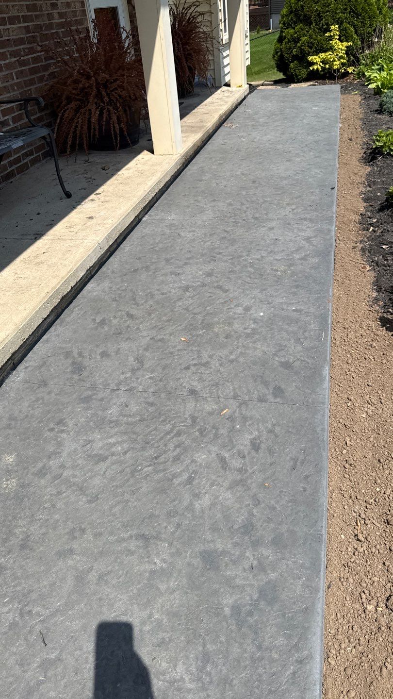 Bluestone stamped concrete patio  by NG Masonry & Construction LLC
