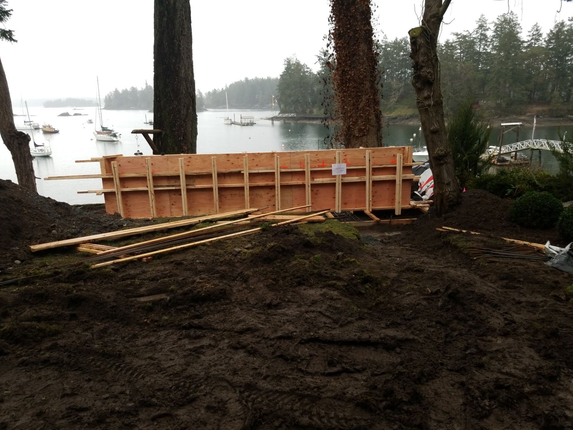 Coastal Landscape Restoration & Retaining Structure - In progress by Habanero Garden and Exterior Care