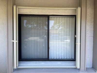 Ivory accordion shutters