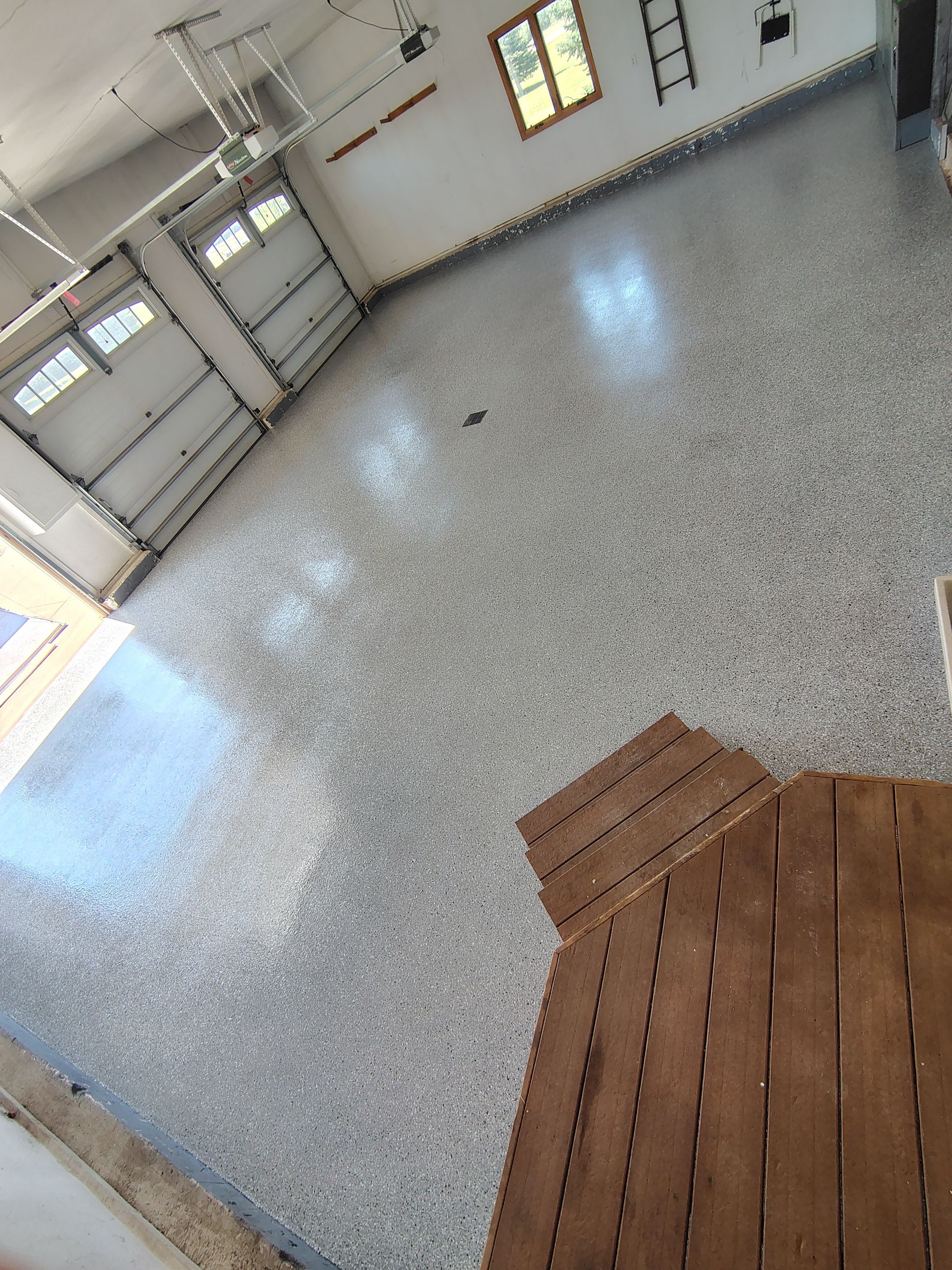 Feather Grey Garage Floor Coating Installation in Valley Springs by Select Painting, Coatings & Garage Cabinets