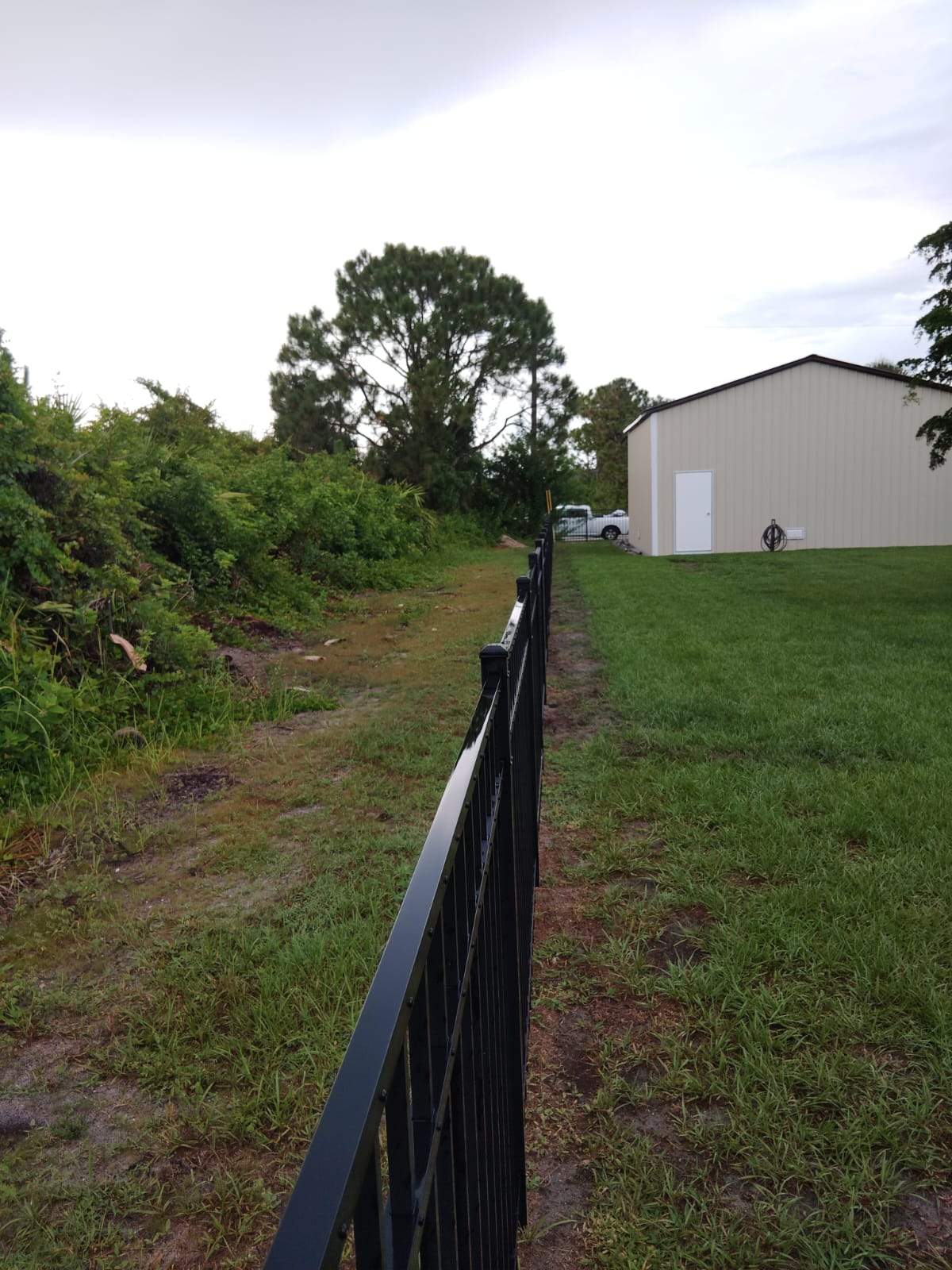 Black Aluminum Picket Fence Installation for Port Charlotte Residence by True Fence LLC