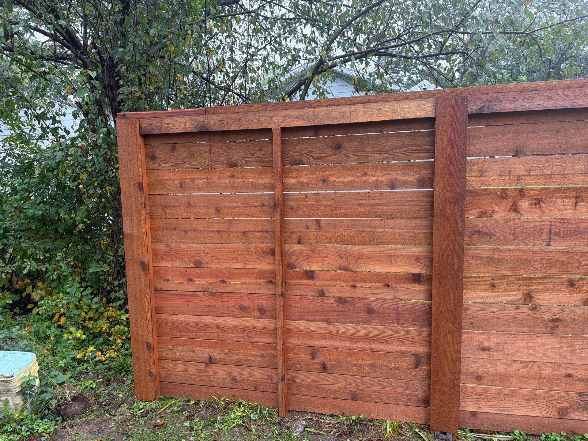 Stained Horizontal Cedar Wood Privacy Fence in Cedar Falls by Perfect Picket Fence and Stain