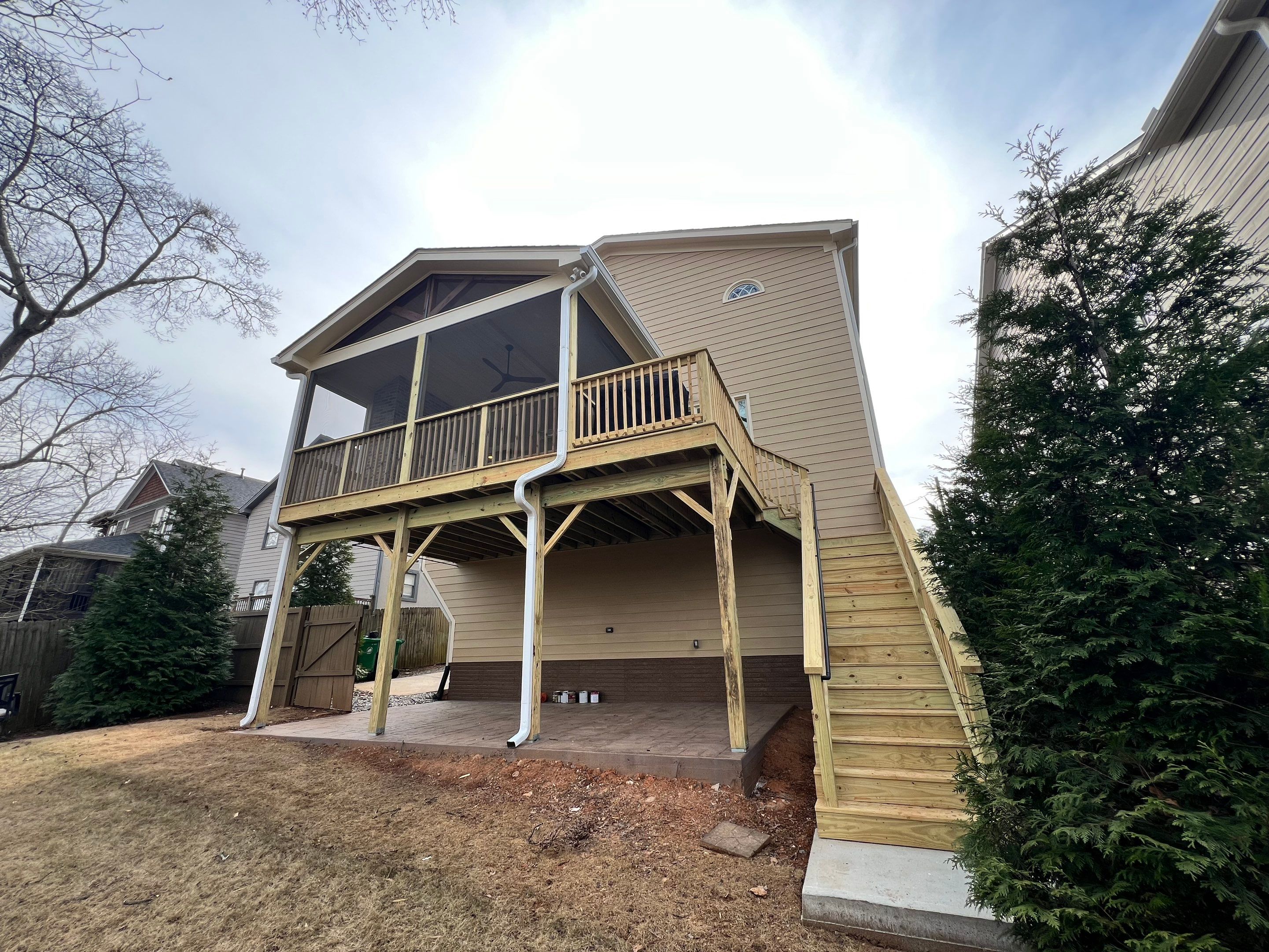 Screened-In Porch With Fireplace by Swift Home Renovations 
