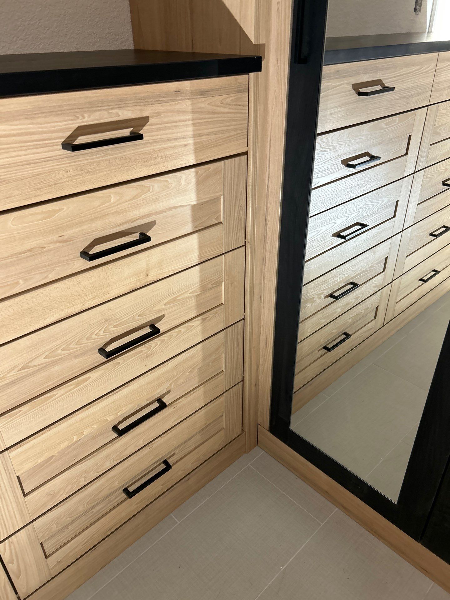 Two-Tone Closet with matching Mudroom + Laundry Room by Concept 32, Inc.