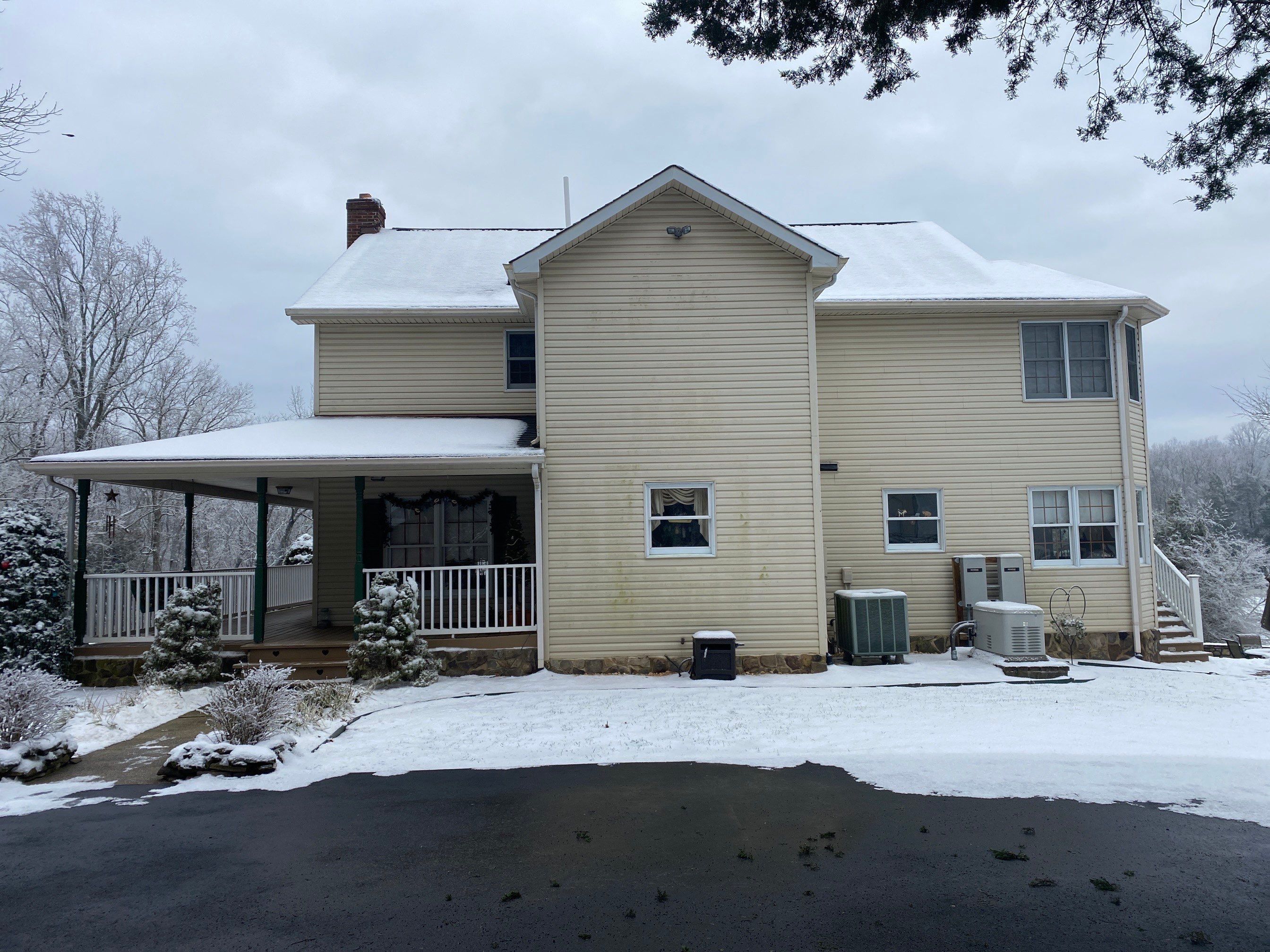 Exterior remodel including window replacement by American Home Contractors