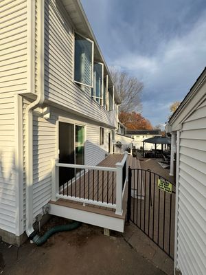 Replacement Deck using Tres Lineage Carmel boards and White Composite railing. 