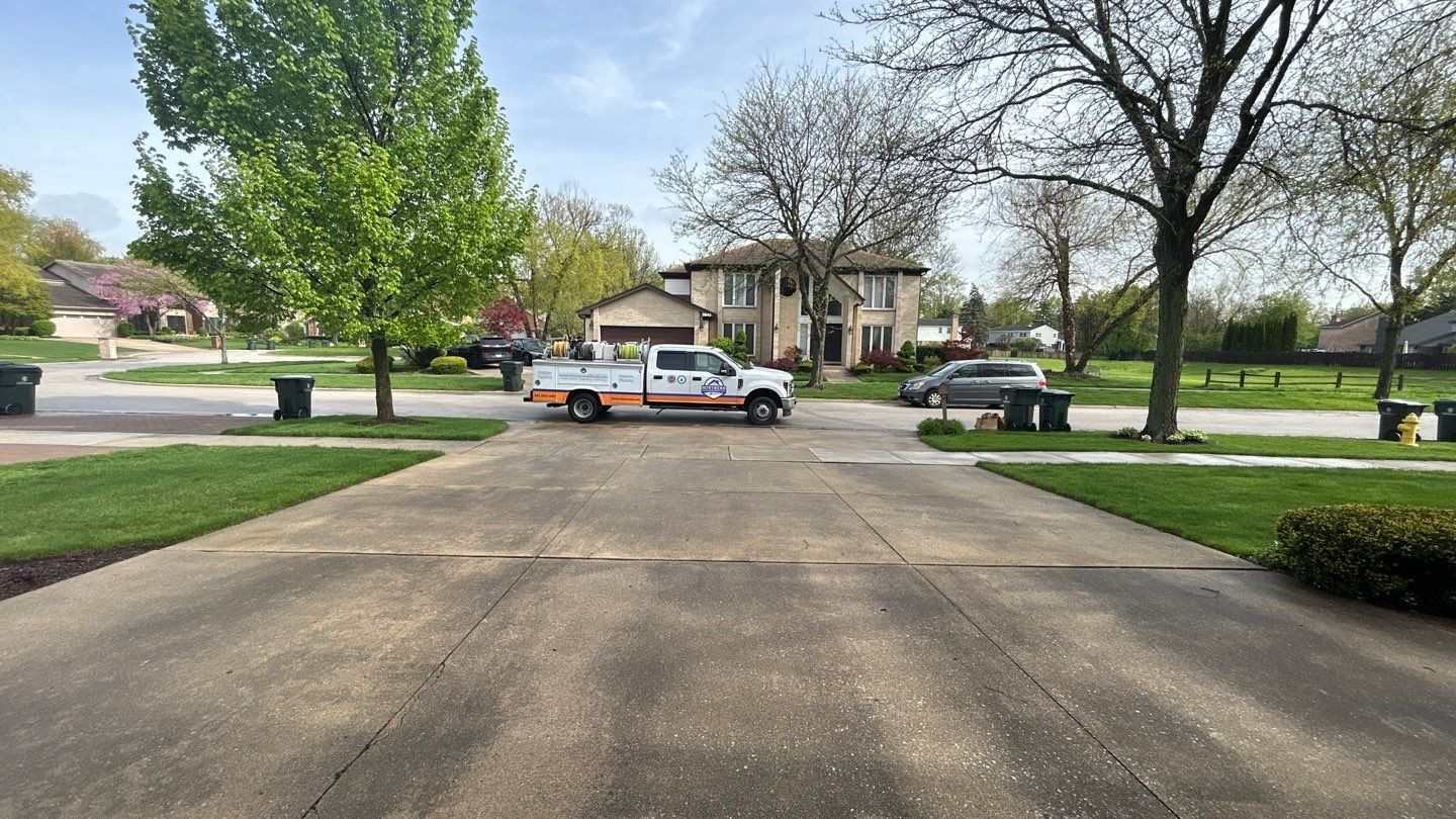 concrete patio and driveway cleaning by Northern Power Washing LLC.