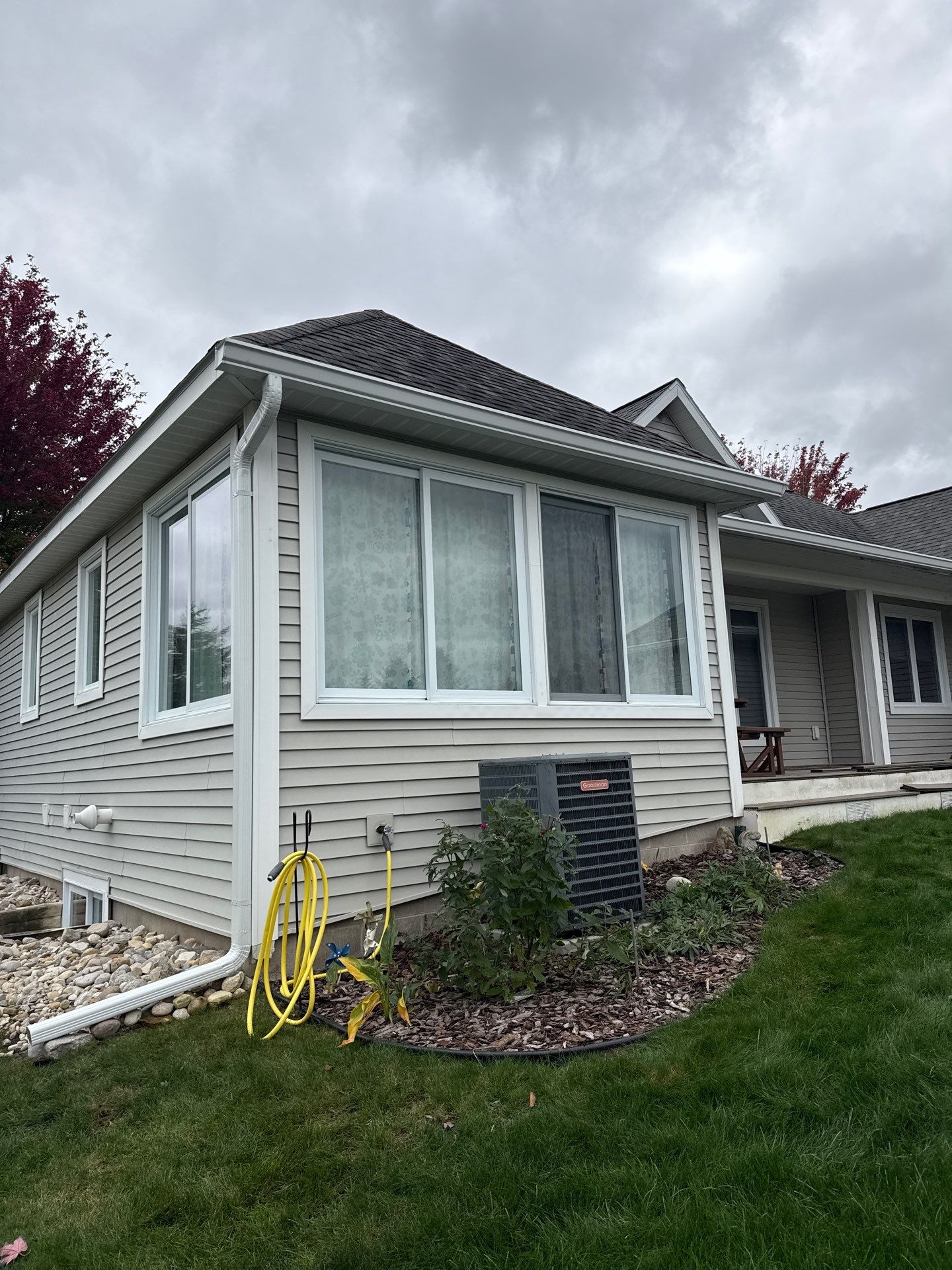 White Gutter System Installation for Traverse City Home by Rainbow Seamless Systems