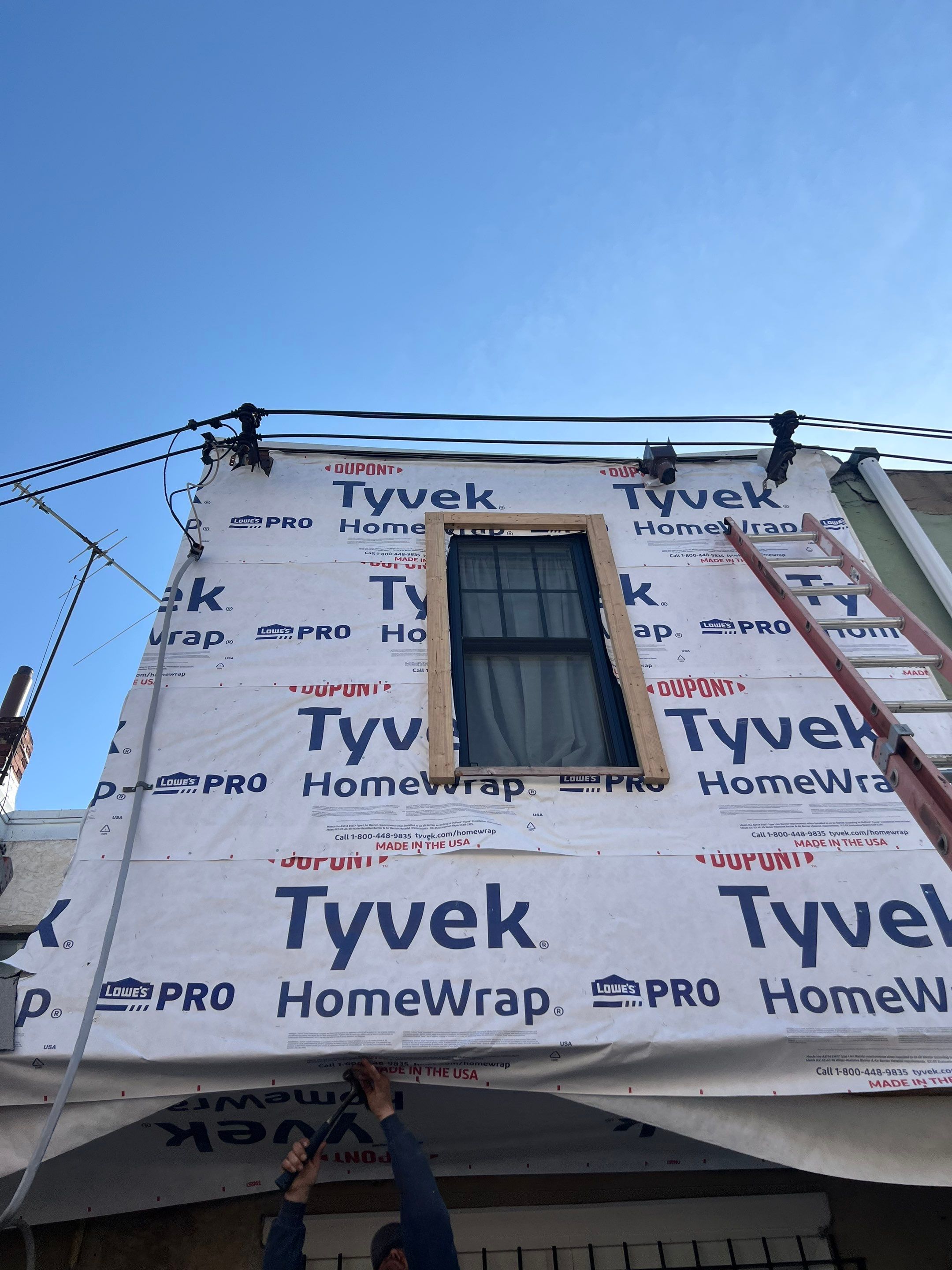 Vertical Black Metal Siding Installation for Philadelphia Home Exterior by Hybrid Roofing And Renovations