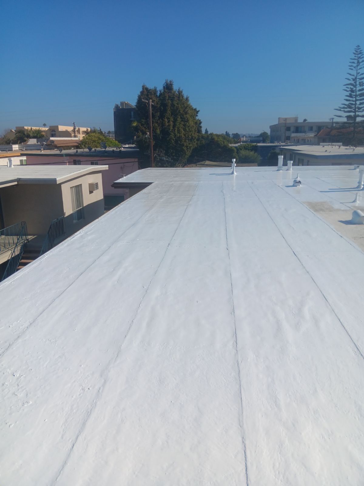 Commercial Roofing Installation using Silicone Coating by Hull Brothers Roofing