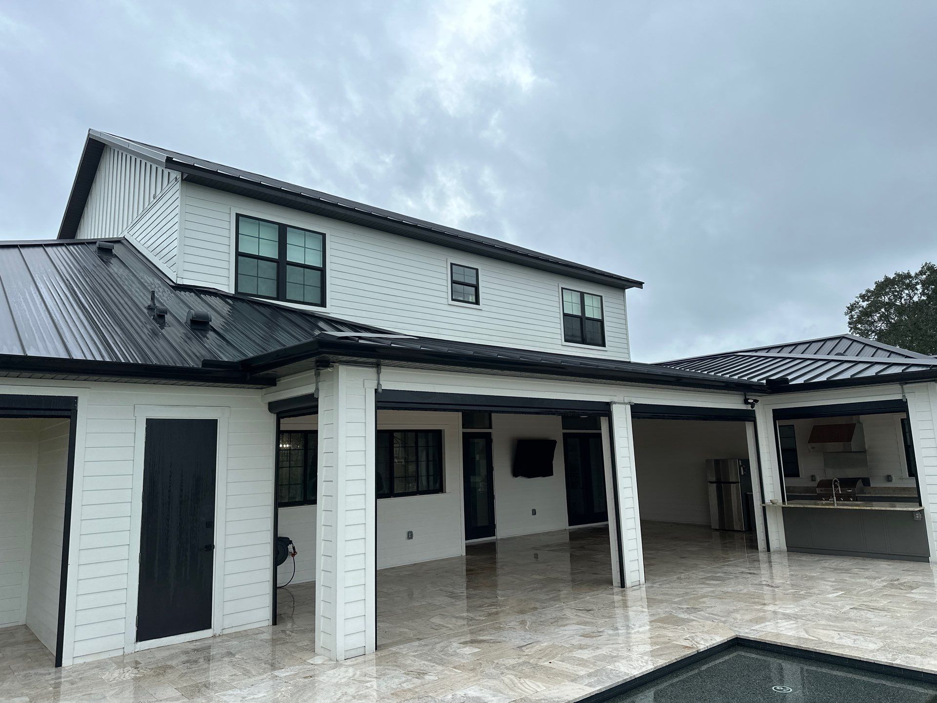 Complete Two-Story House Wash and Driveway Cleaning in Winding River Community, Bradenton, FL by Sunshine AquaWash