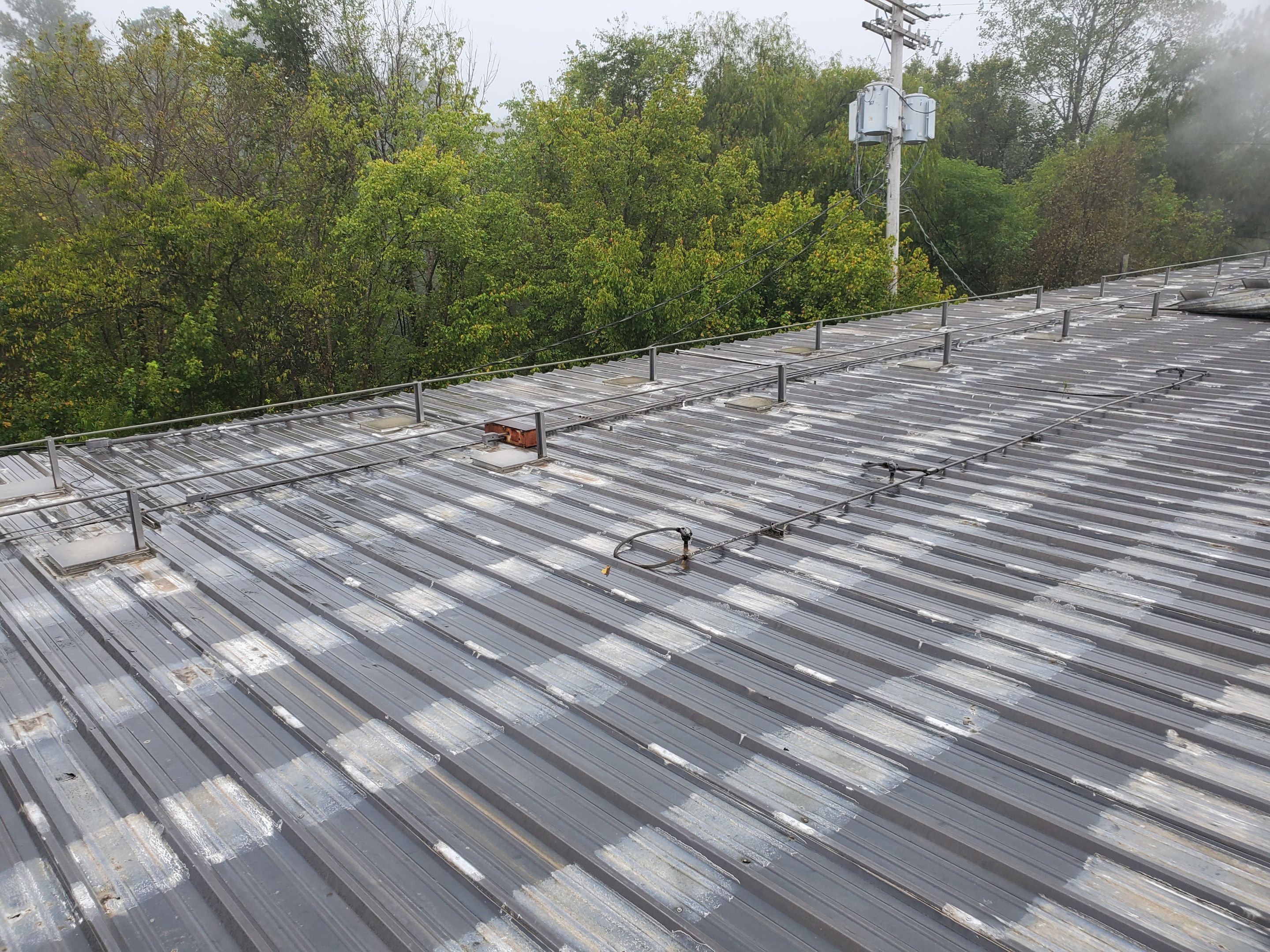 Commercial Roofing Installation using Aluminum Roofing panels by Hostetler Roofing