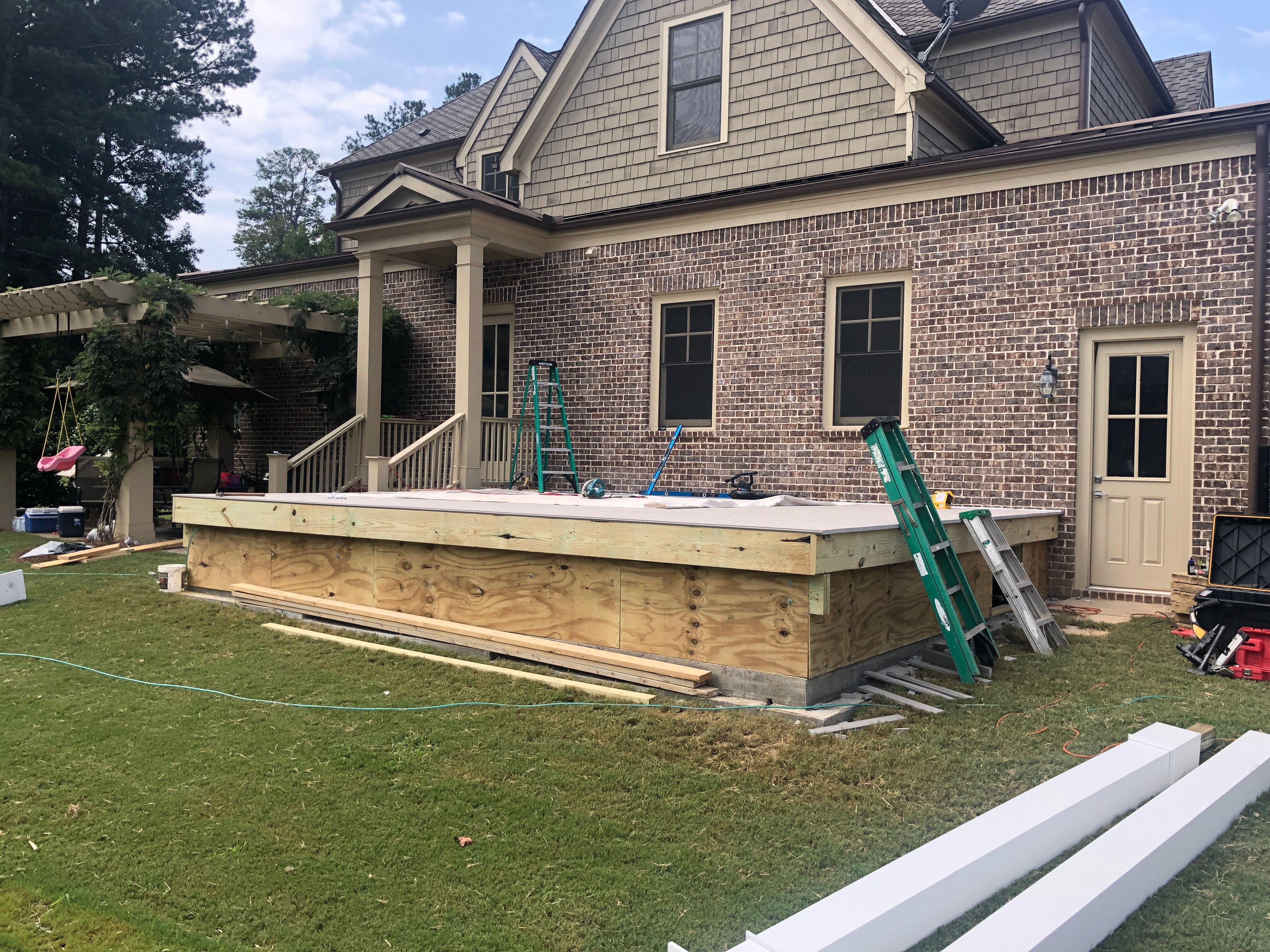Custom Screened Porch Addition with White Brick Fireplace in Duluth by Swift Home Renovations