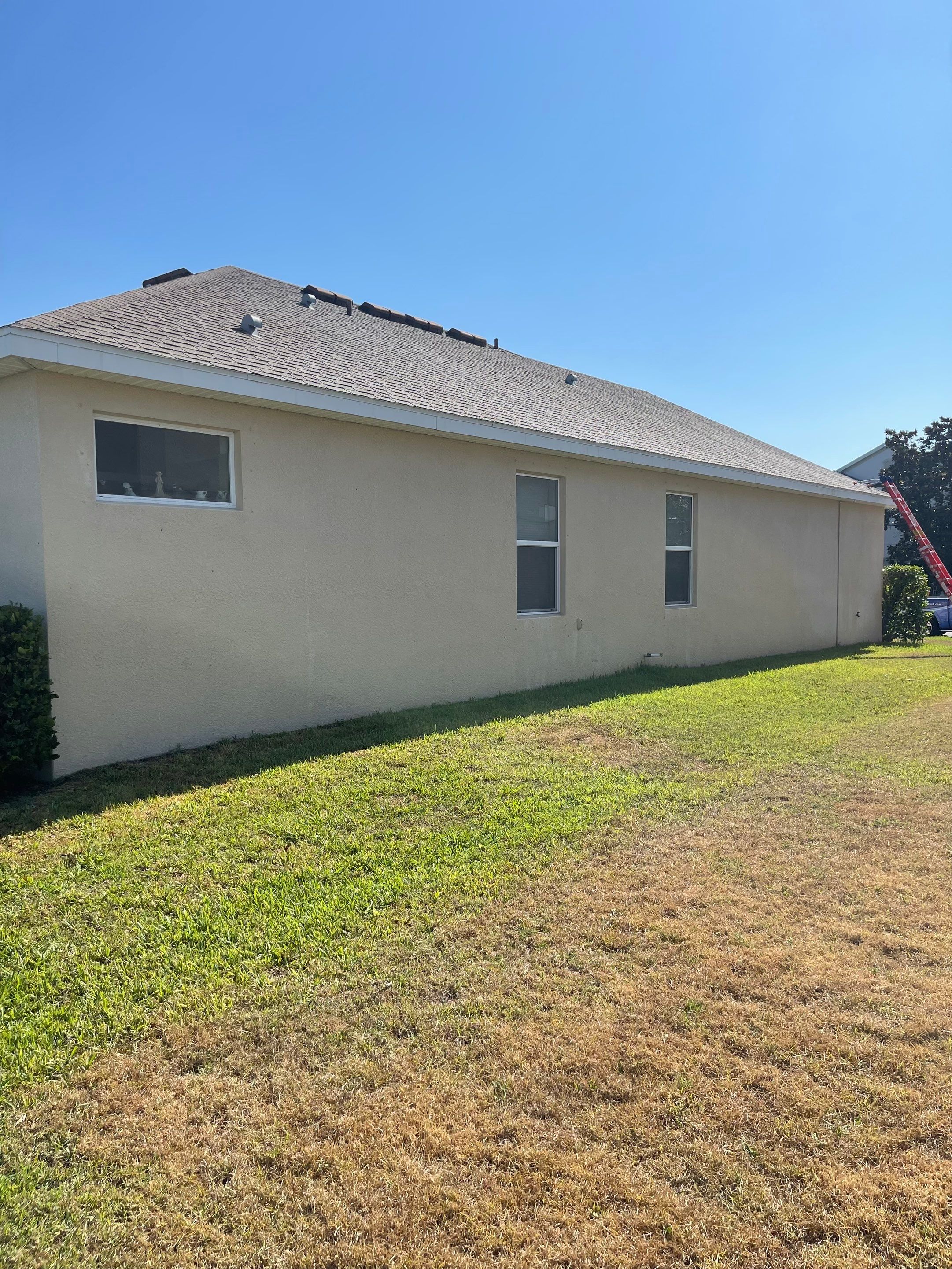 Asphalt Shingle Roof Soft Wash Cleaning & Concrete Pressure Washing in CopperStone Community, Parrish, FL by Sunshine AquaWash