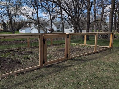 Custom Cedar Wood Garden Fence Installation in Cedar Falls