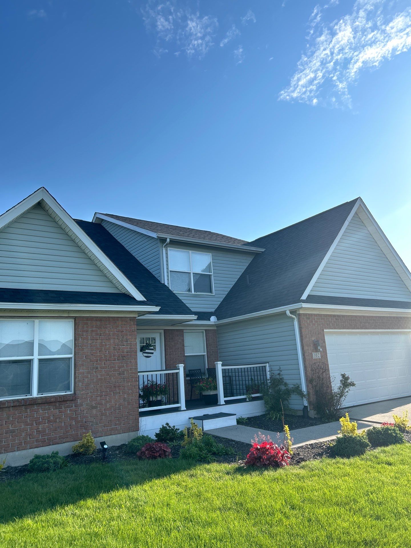 Exterior Installation using Onyx Black Durations and White Siding by WIW Enterprises Inc