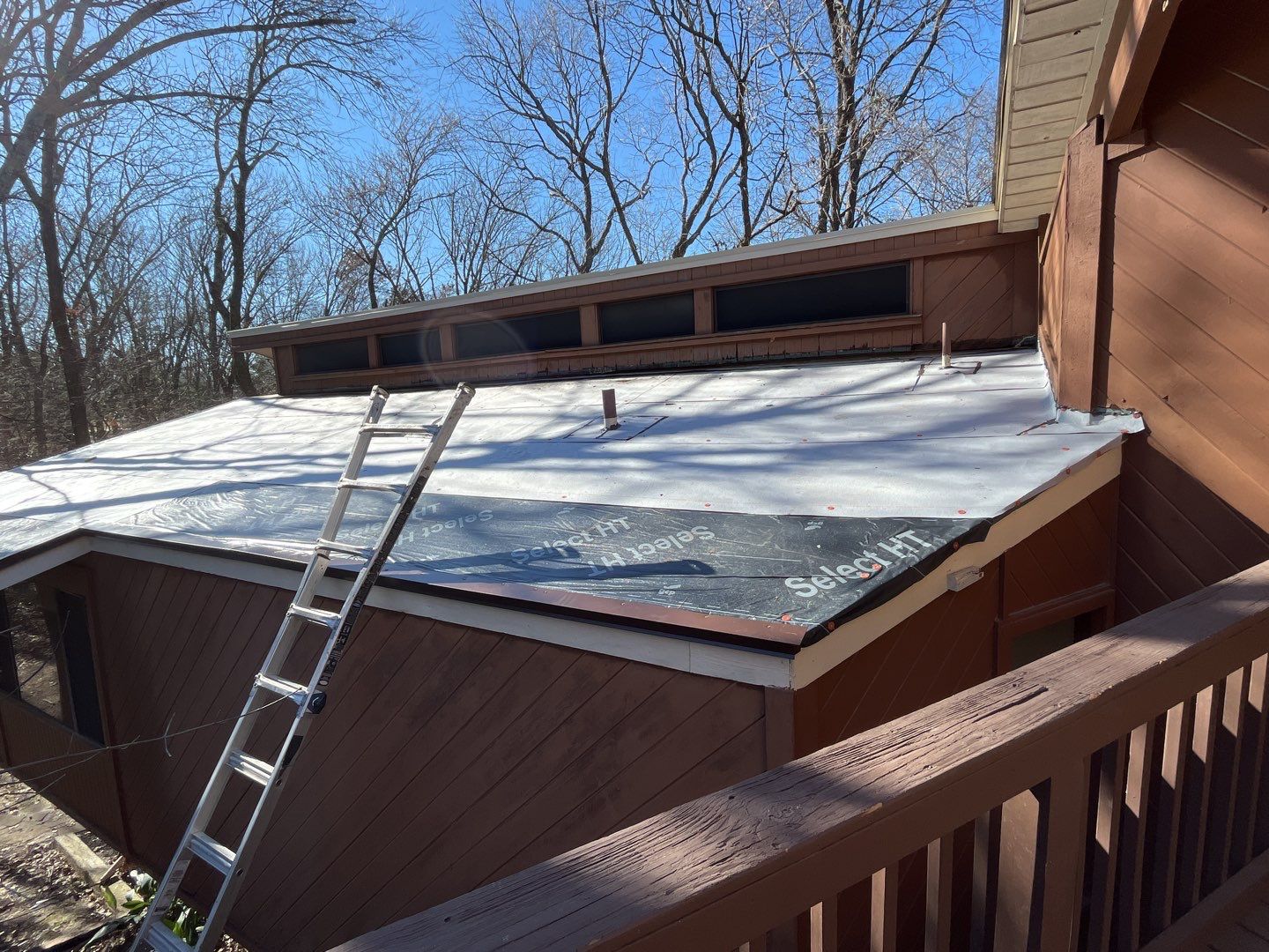 Residential Roofing Installation using Standing Seam Metal Roofing and Composition Shingles by Rainy Day Restoration