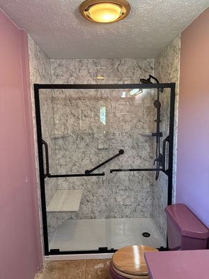 Kingsley Bath and Shower Remodel with Marble-Patterned Acrylic Surround