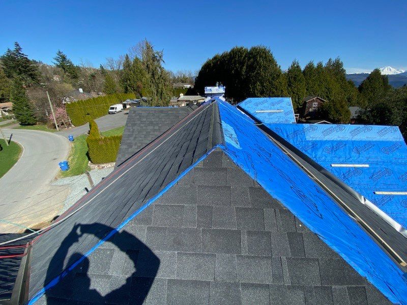 Residential Roofing Installation using Malarky Vista Midnight black by Top Notch Roofing Inc
