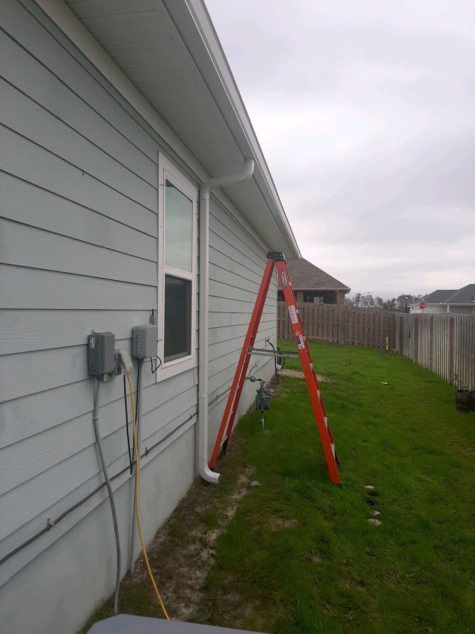 Gutter Installation Using White K-Style Seamless Gutters by Gutter Professors