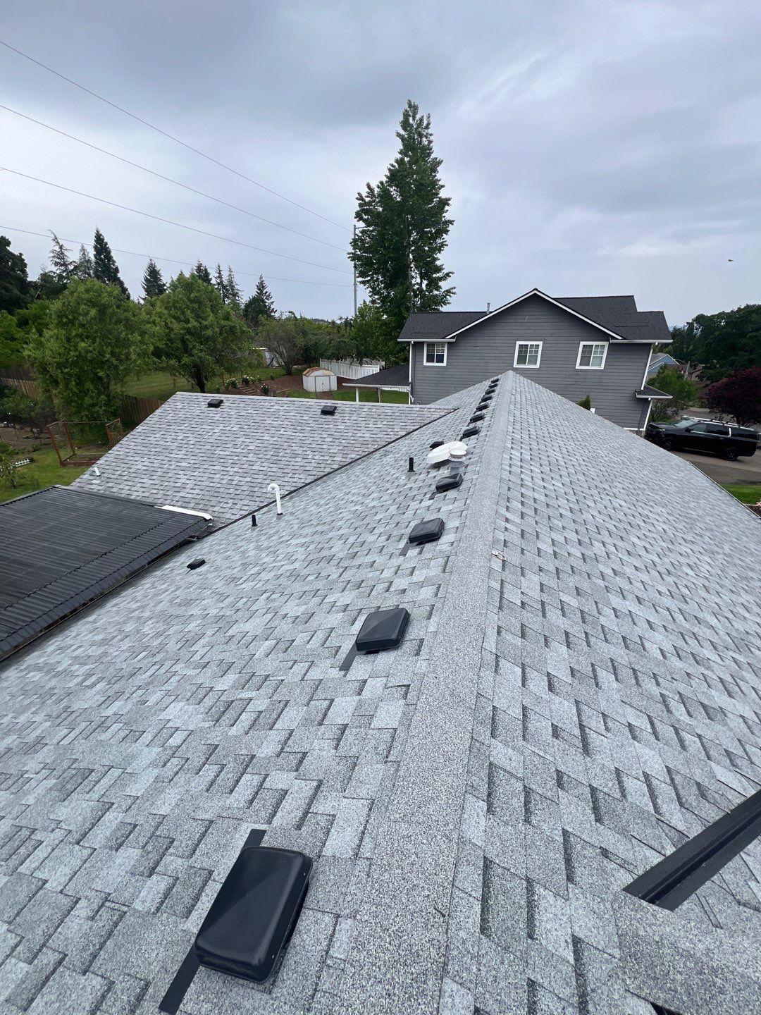Residential Roofing Installation using IKO Cambridge (Color: Dual Grey) by Orezona Building & Roofing Company, Inc.