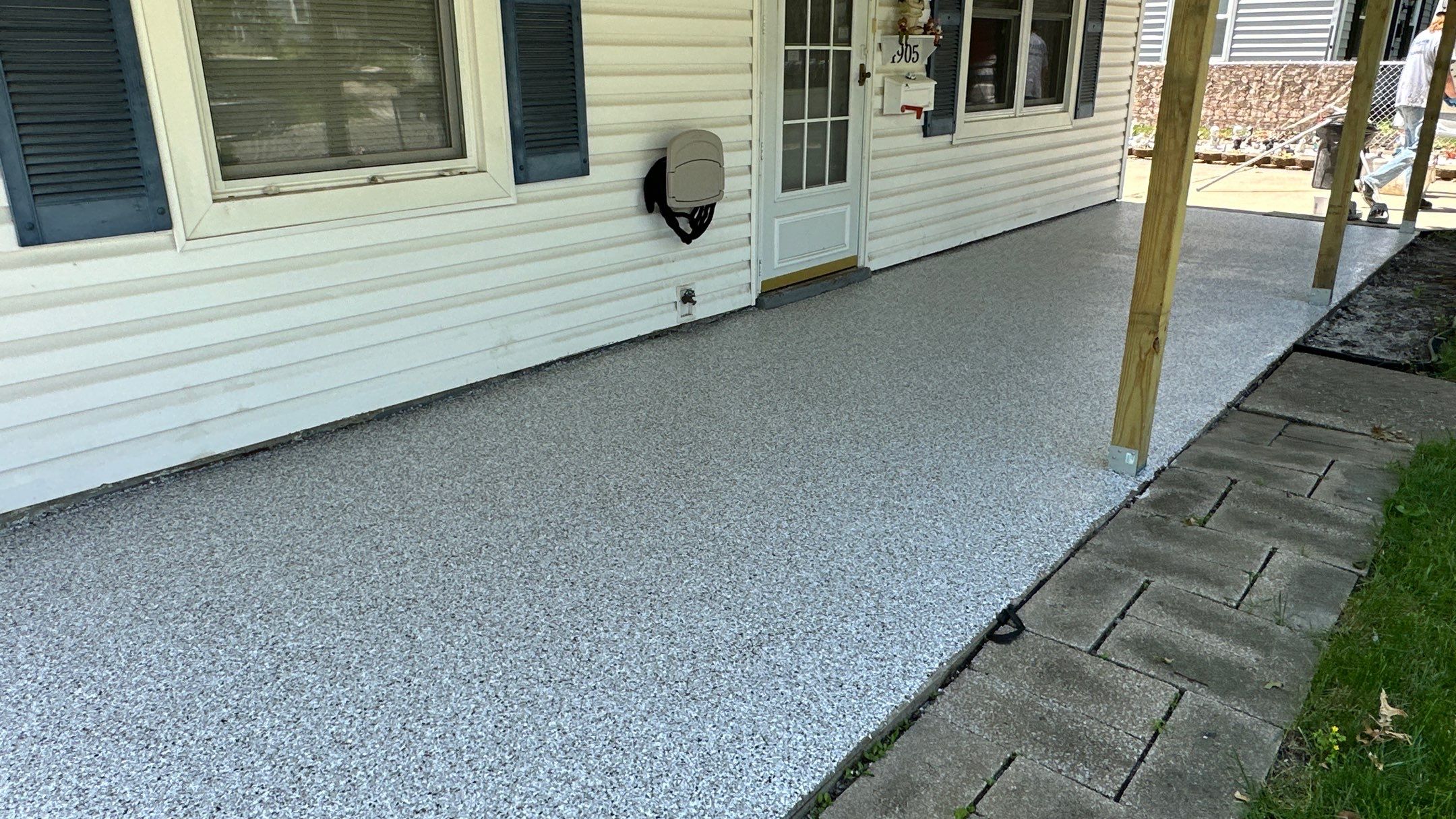 Look at this beautiful Coyote flake floor on this patio by Banner Garage