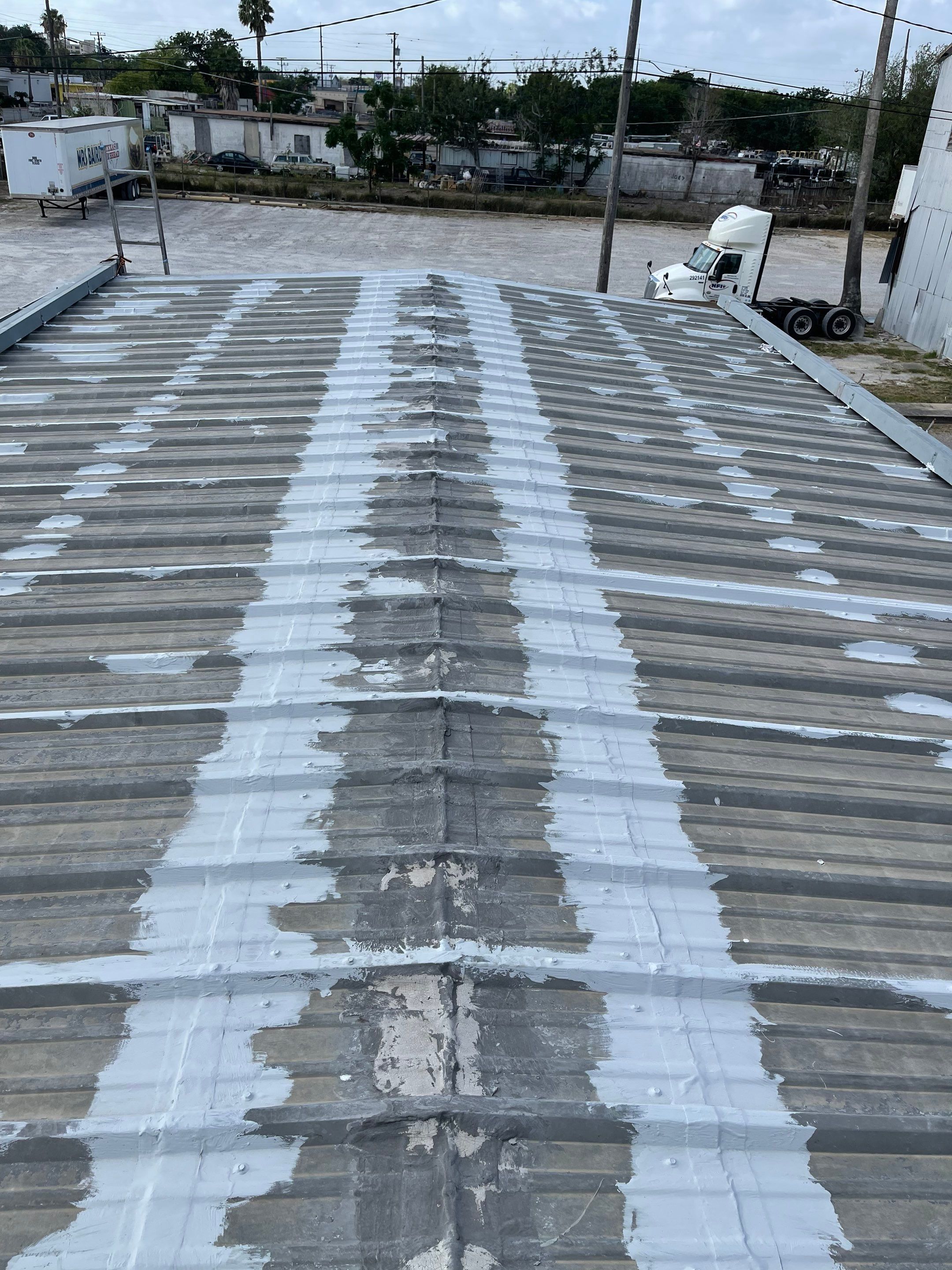 Commercial Roofing Installation using GAF 10 Year Acrylic System by Lighthouse Roofing