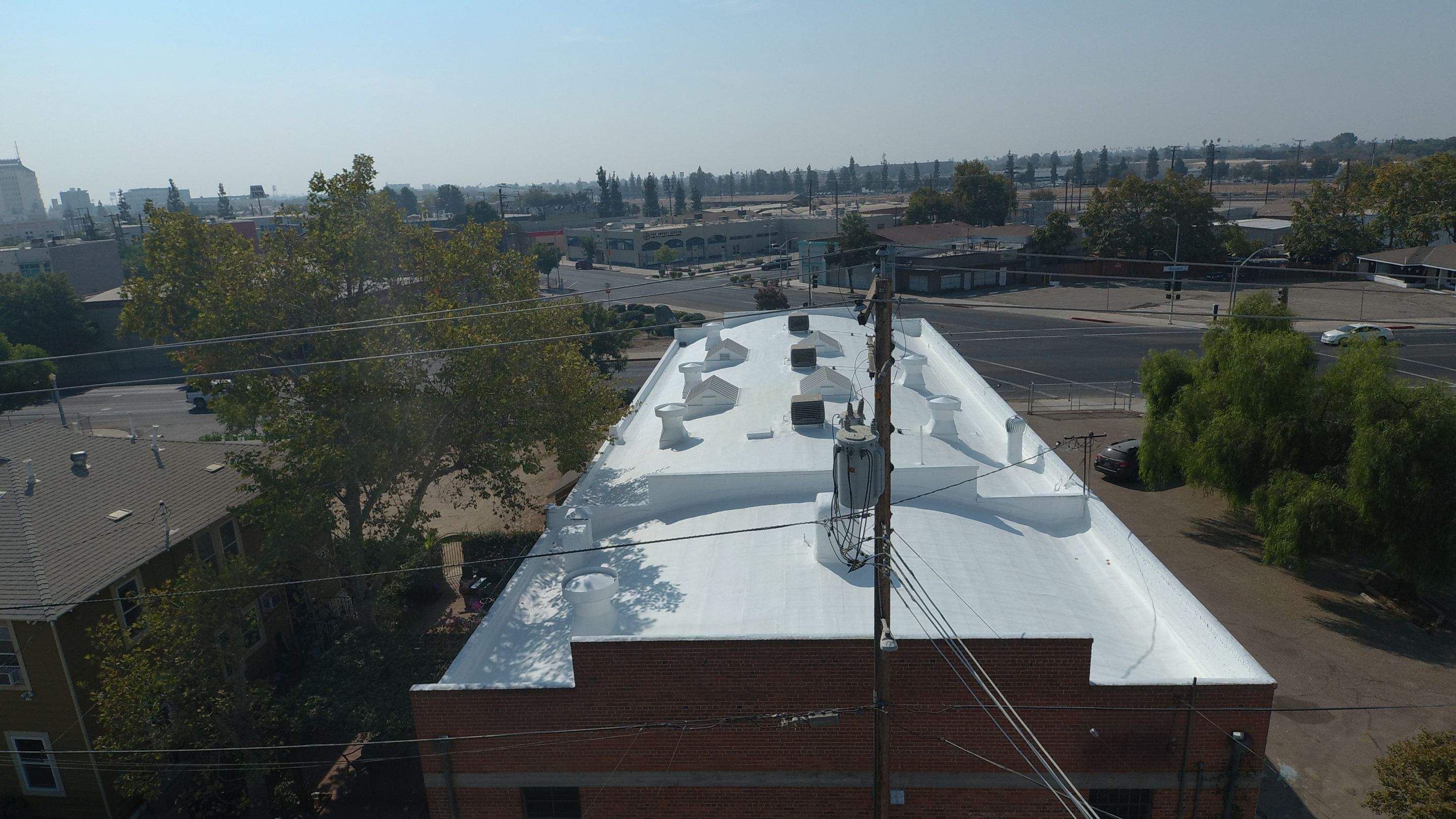 Polyurethane foam roof refurbish and recoating by Straight Edge Roofing Inc