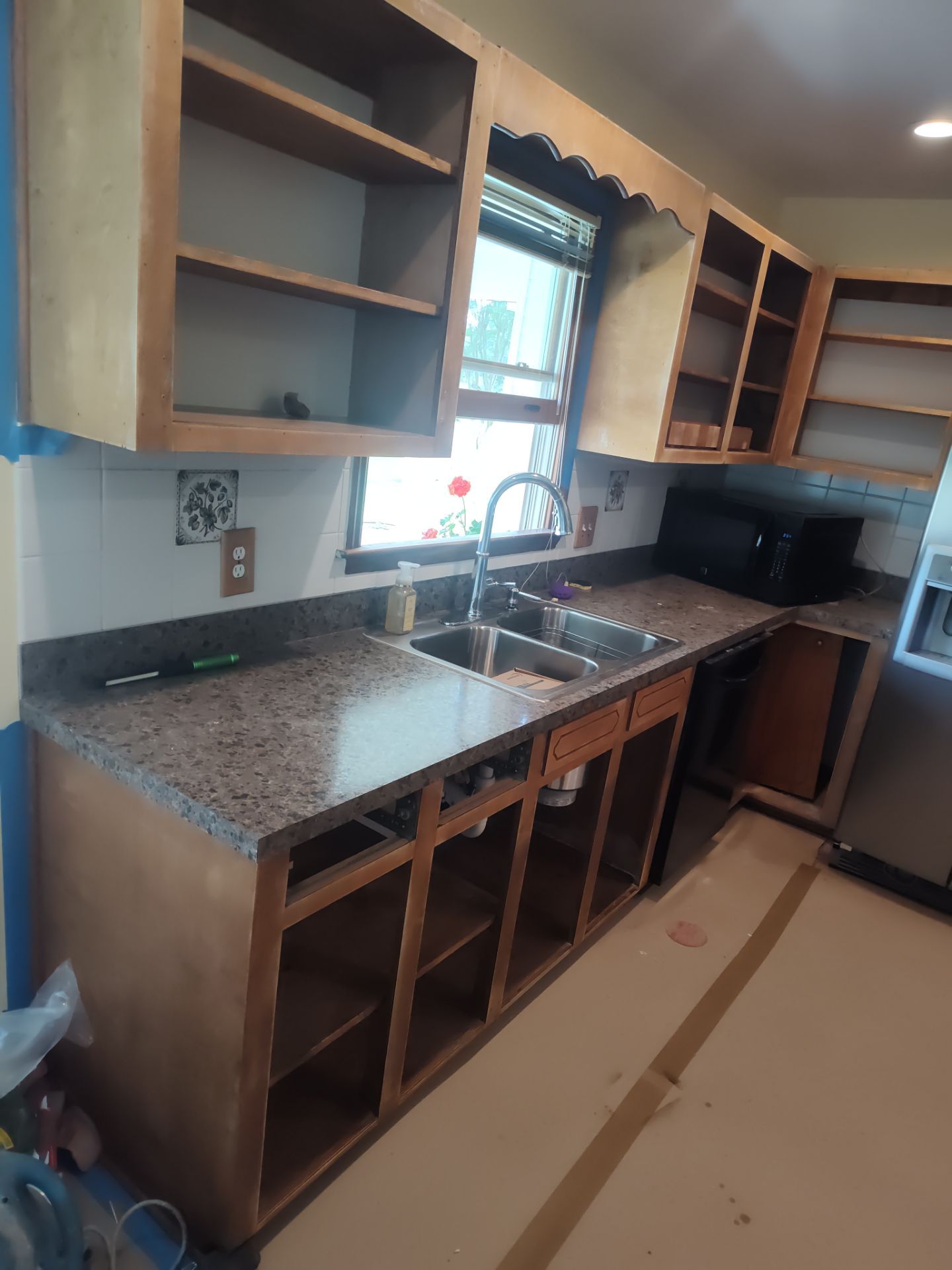 Remodel Kitchen refinishing cabinets by Cornerstone Home Builders, LLC