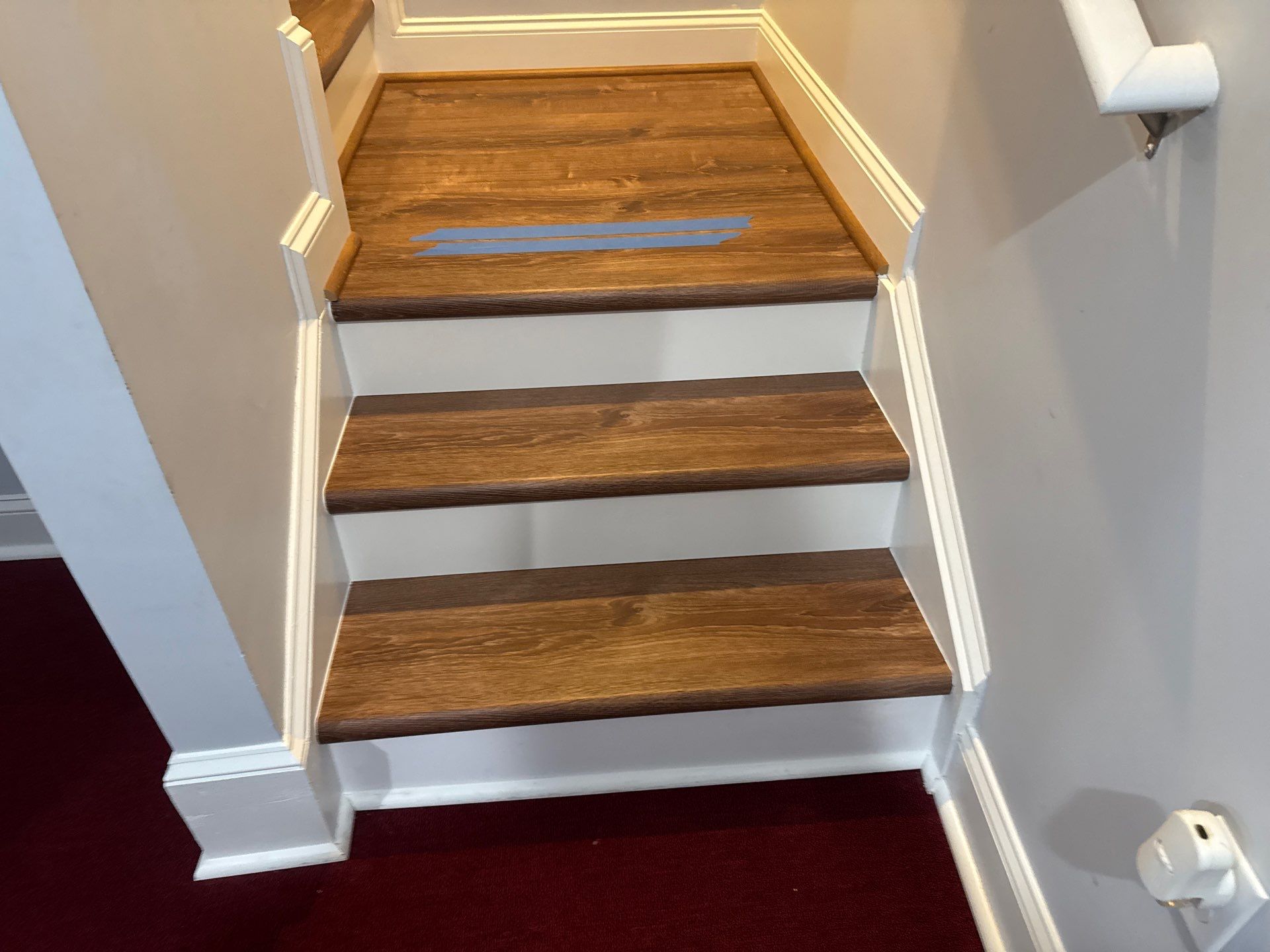 Stairway Installation using t vinyl stair tread and reversibleriser by La Bendicion Contruction Llc