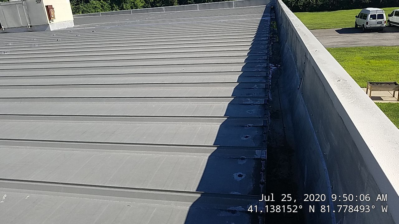Commercial Metal Roof Coating by Gold Star Roofing LLC