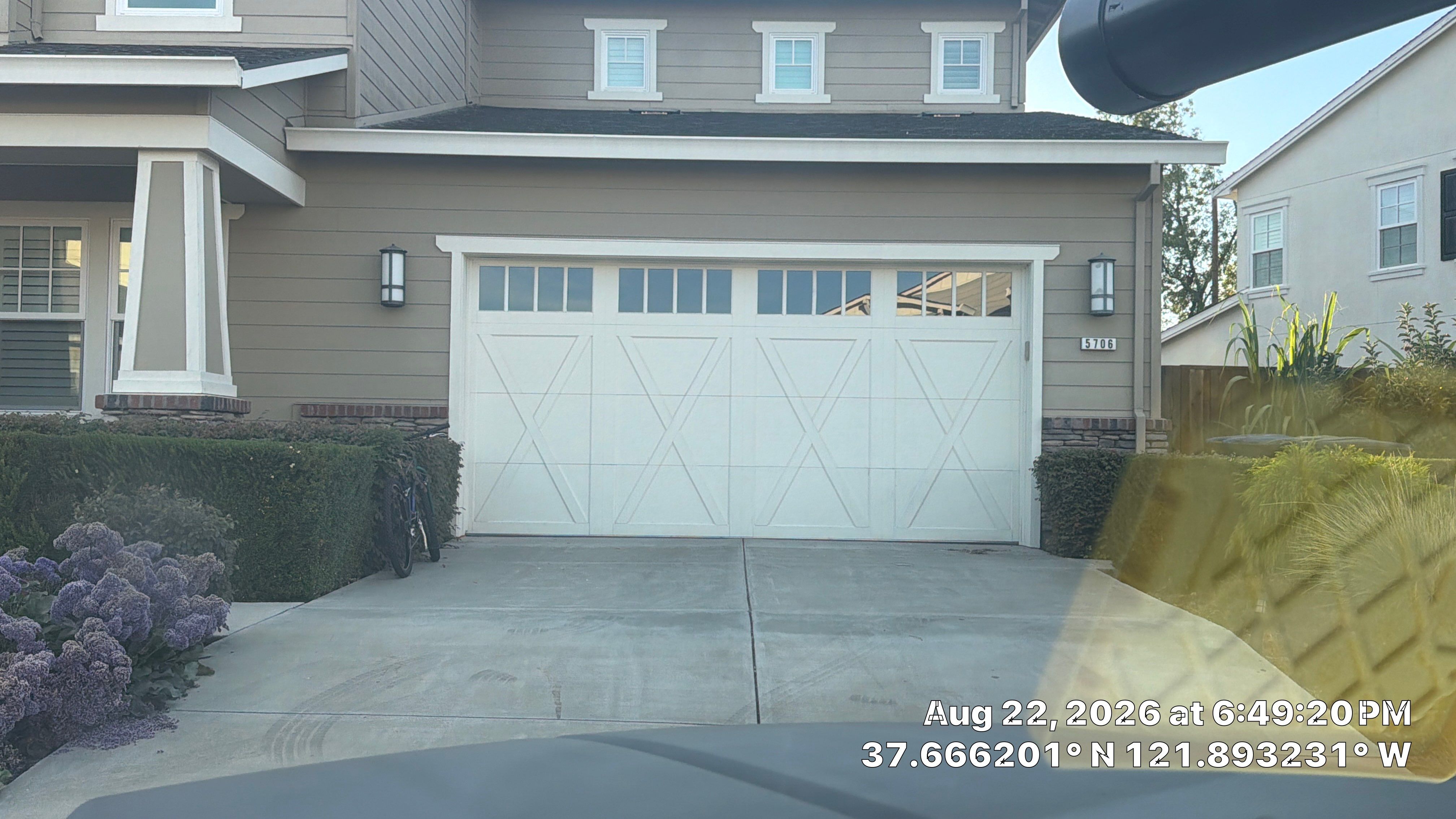 White Carriage-Style Garage Door Installation with Decorative Windows in Pleasanton
