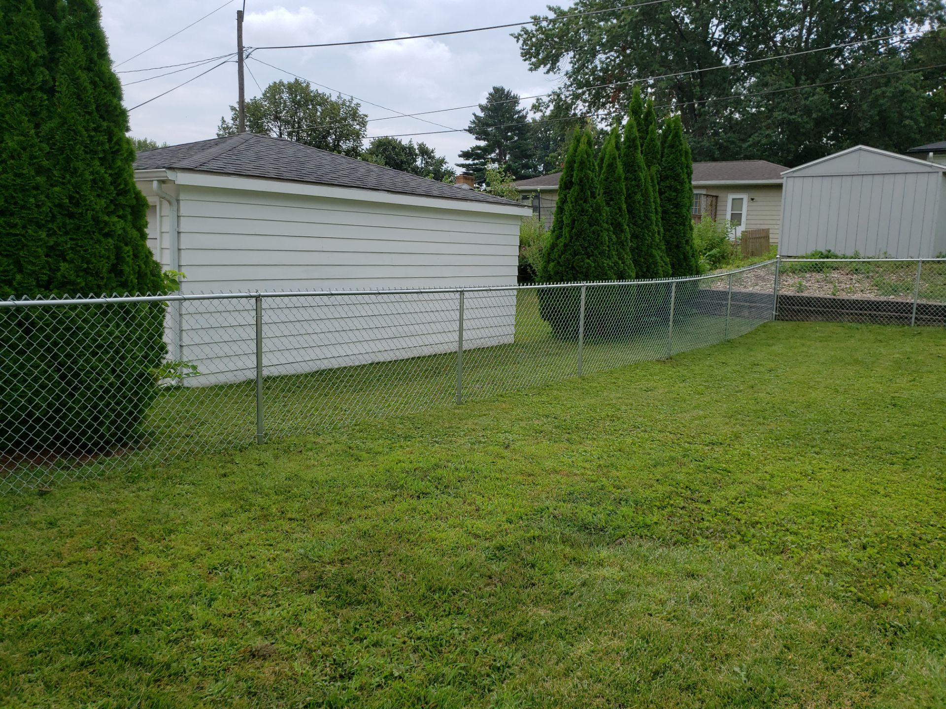 Residential Chain Link Fence and Gate Installation in Waterloo by Perfect Picket Fence and Stain