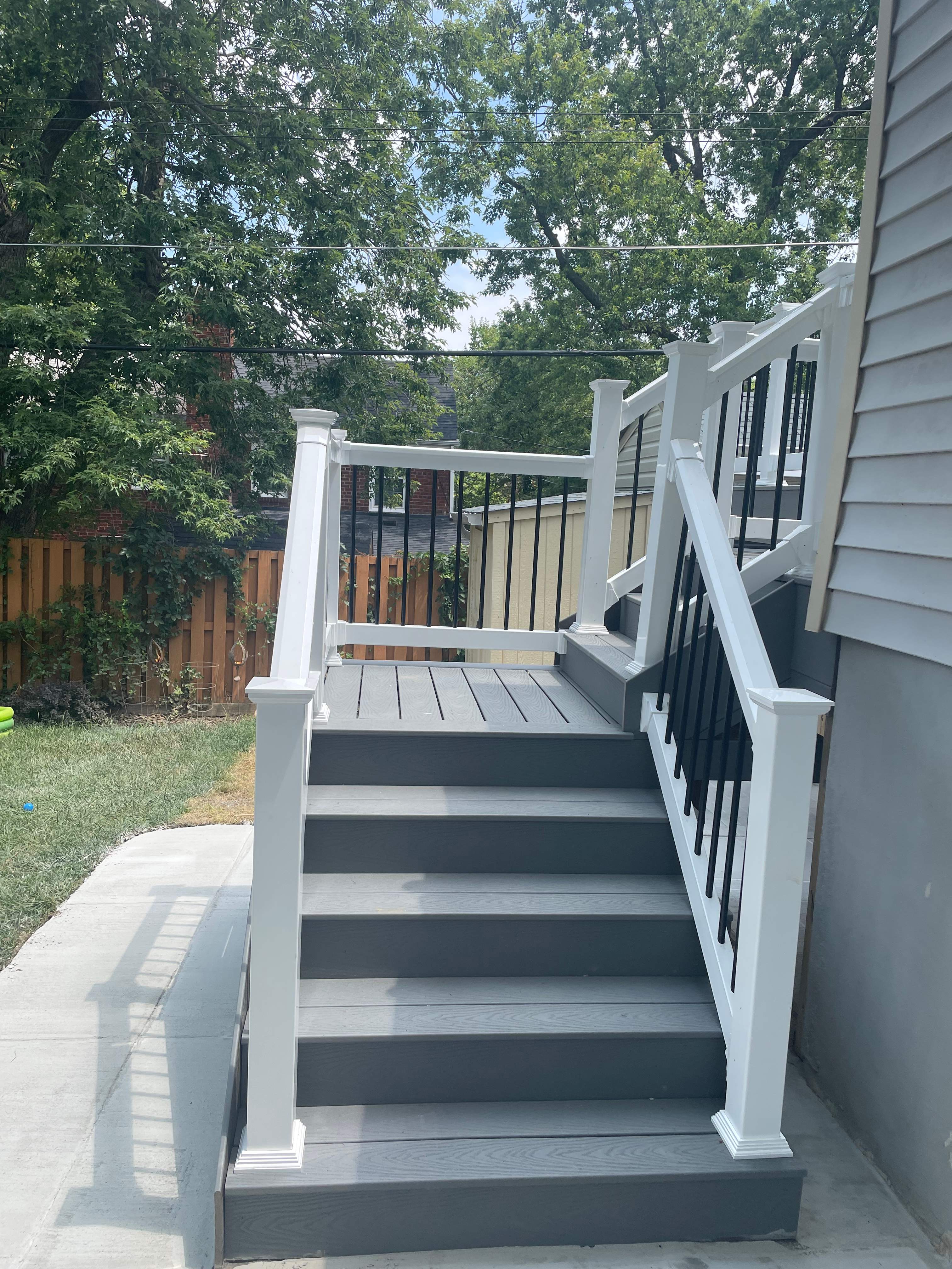 Deck resurfacing, railing replacement and concrete resurfacing by Fairfax Contractors, LLC