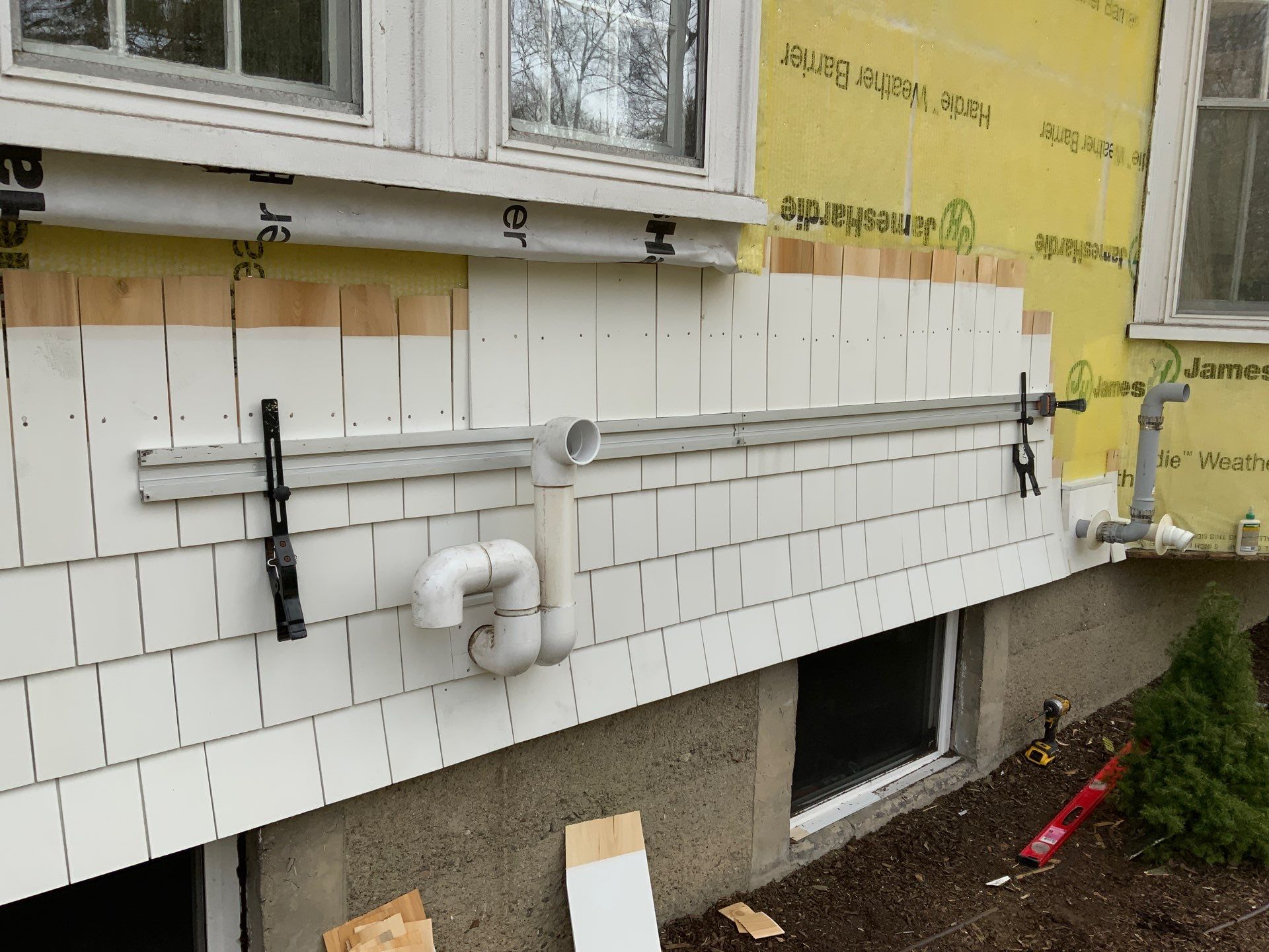 White cedar shingles and windows in Wayland, MA by UBrothers Construction