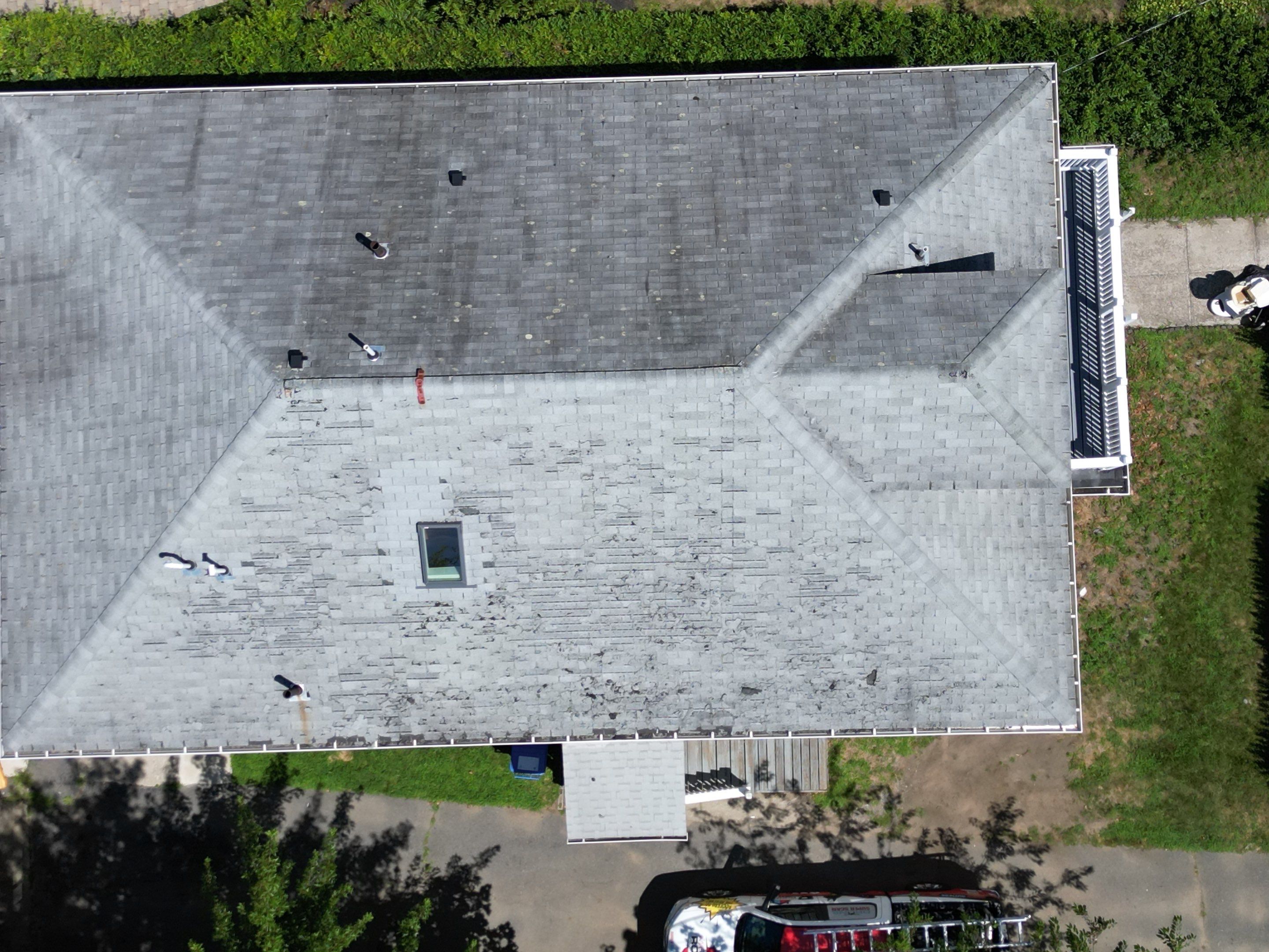 Roof Replacement with Skylight Flashing in Waltham, MA by Mighty Dog Roofing of Greater Middlesex County