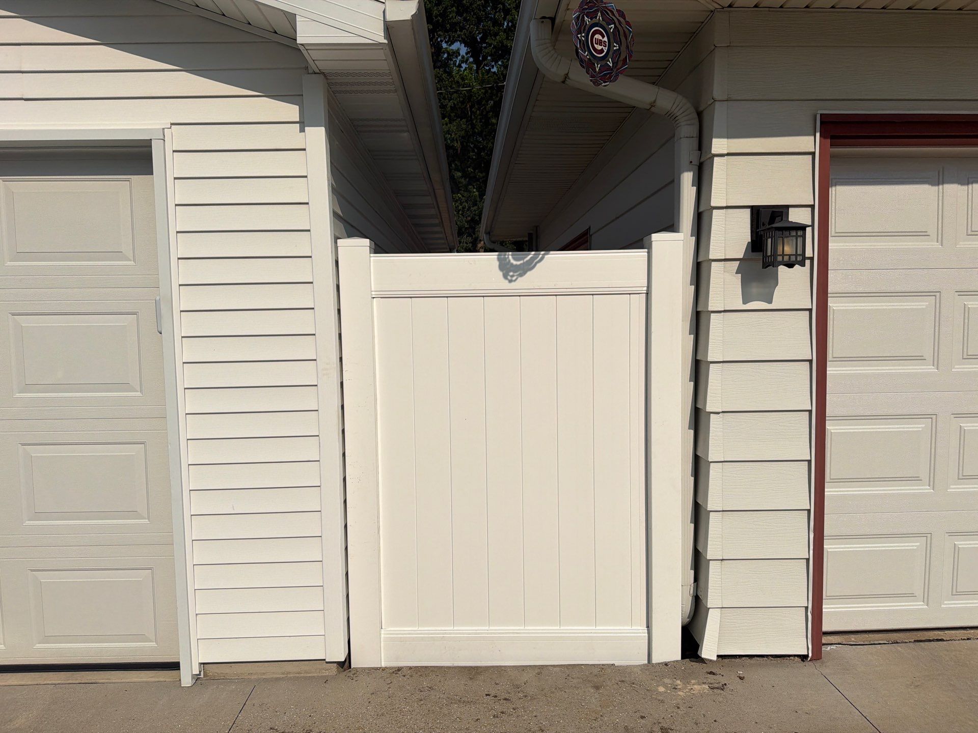 White Vinyl Privacy Fence Installation and Side Yard Upgrades in Waterloo by Perfect Picket Fence and Stain