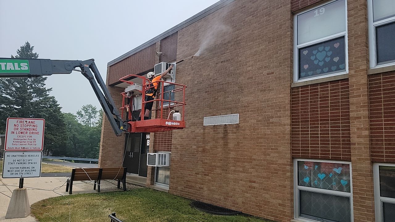 Commercial brick exterior cleaning by Northern Power Washing LLC.