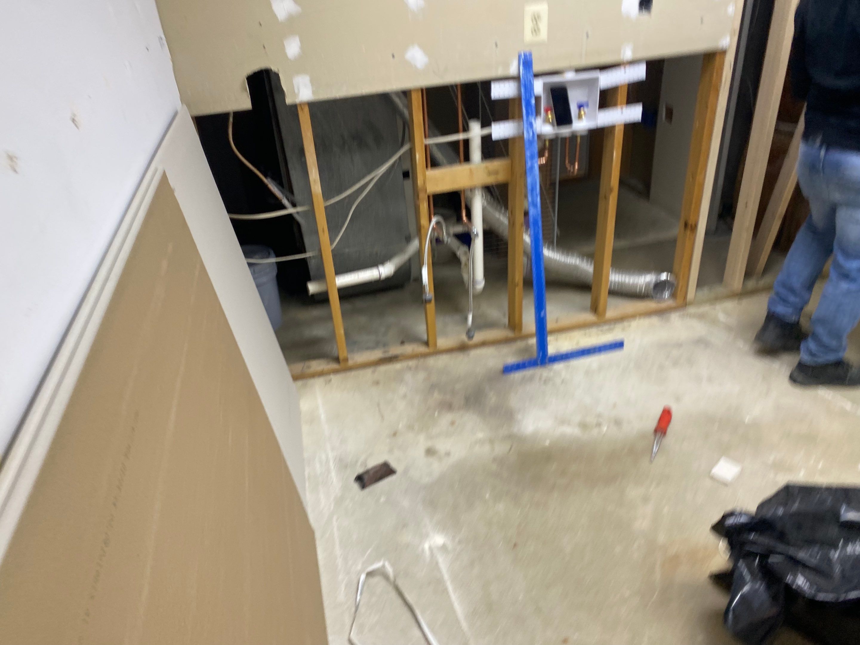 Laundry Room Redmodel using Lifeproof Luxury Vinyl Plank Flooring by The Smet Companies, LLC