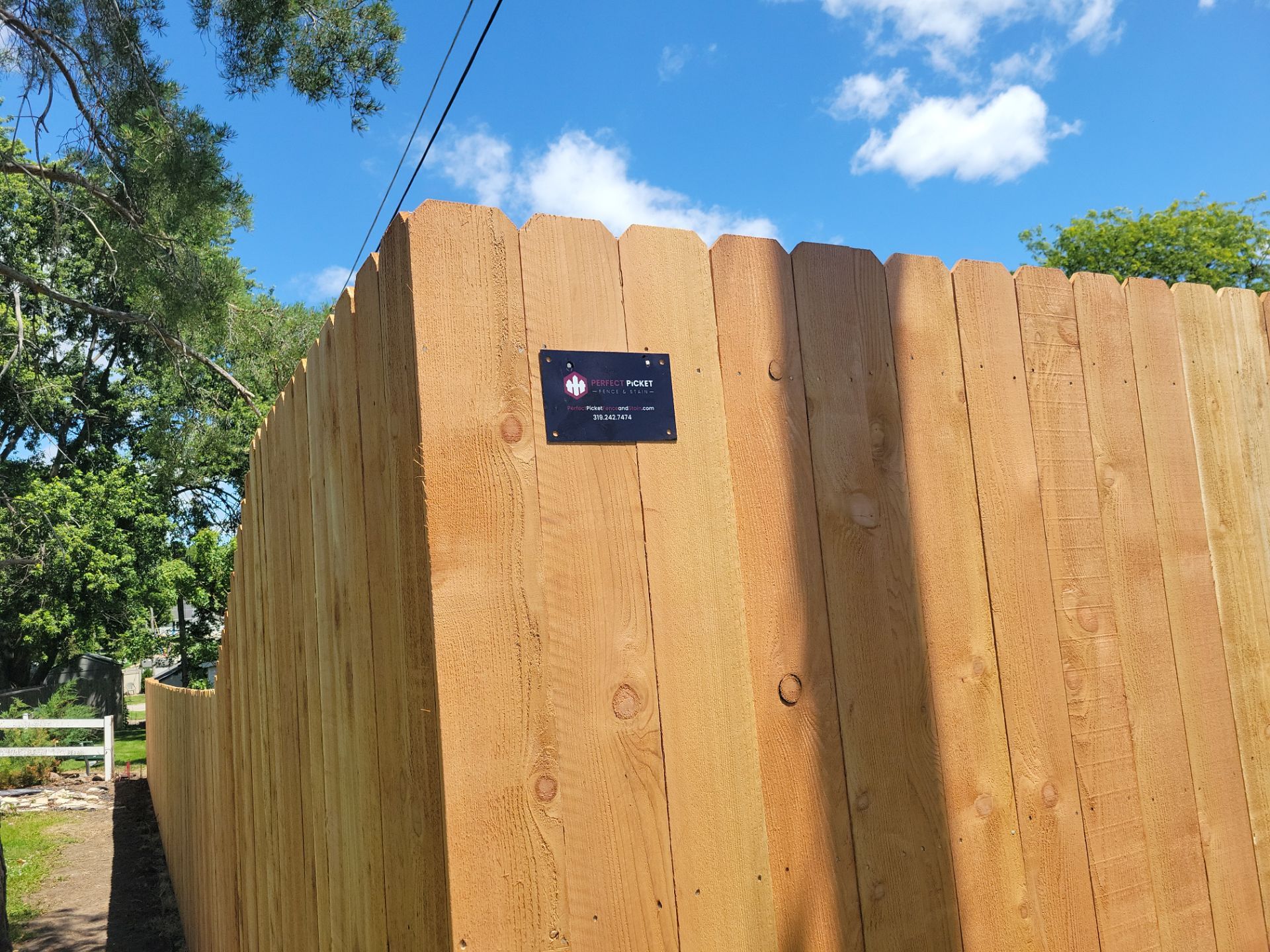 Custom Cedar Unstained Wood Privacy Fence Installation in Cedar Falls by Perfect Picket Fence and Stain