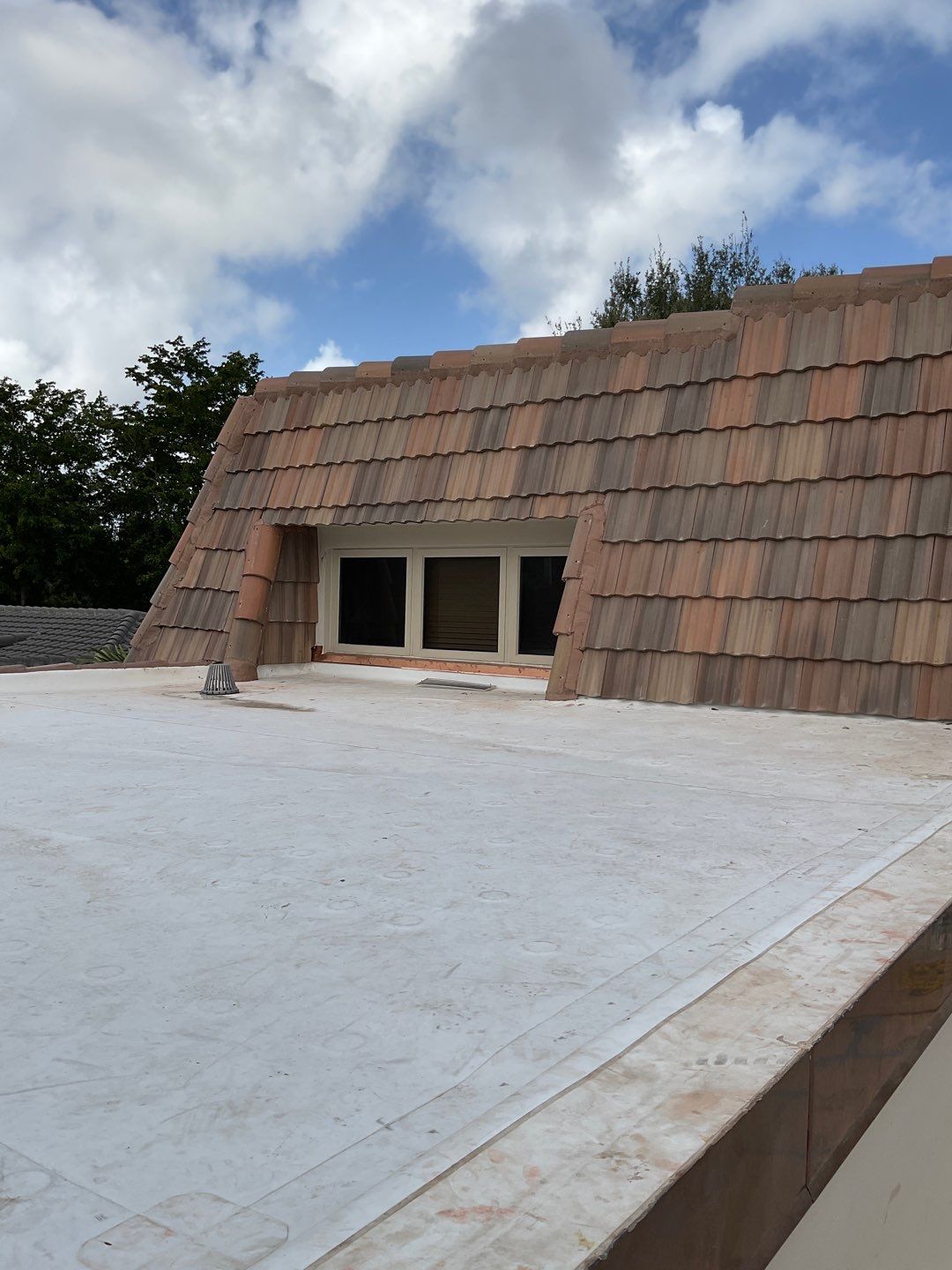 Amazing TPO flat deck re-roof with Eagle mansard in Hollywood Florida.  by First Due Roofing
