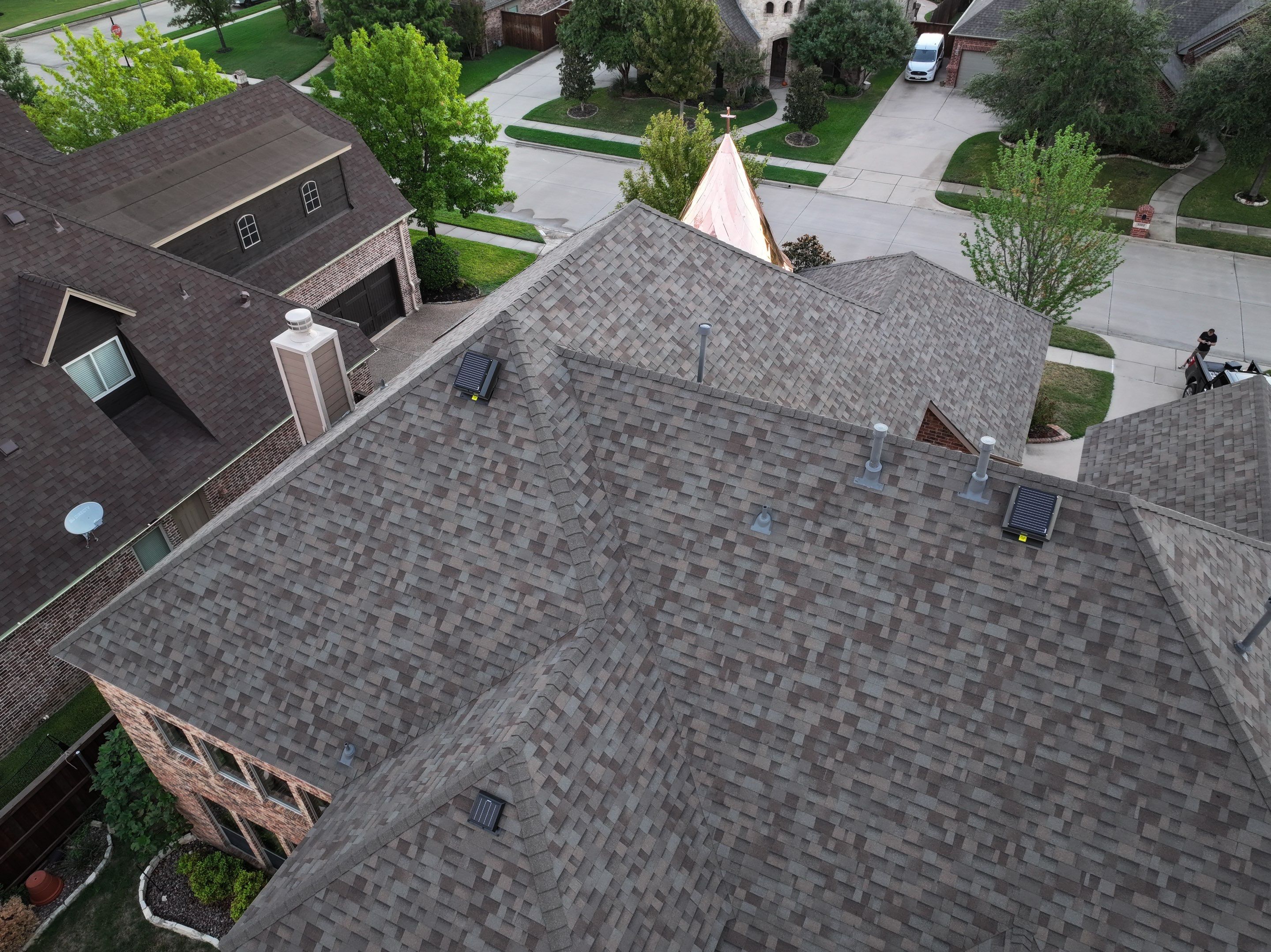 Installing Custom copper turret and Malarkey Vista Class 4 shingles Hail Damage Upgrade by Becker Roofing and Exteriors