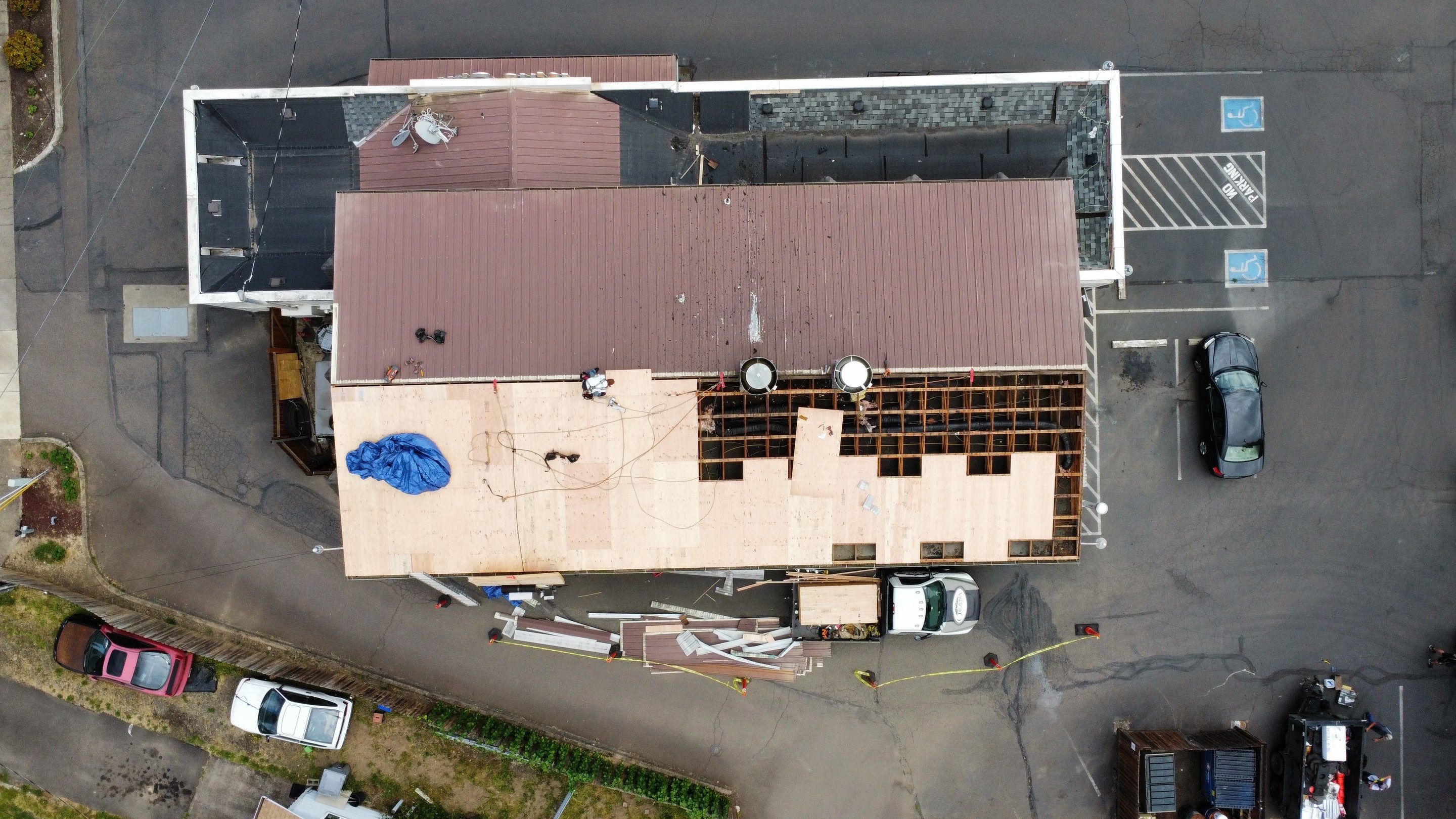 Commercial Flat Roof Installation using Bruce and Dana Snap Lock Metal (Color: Brown) by Orezona Building & Roofing Company, Inc.
