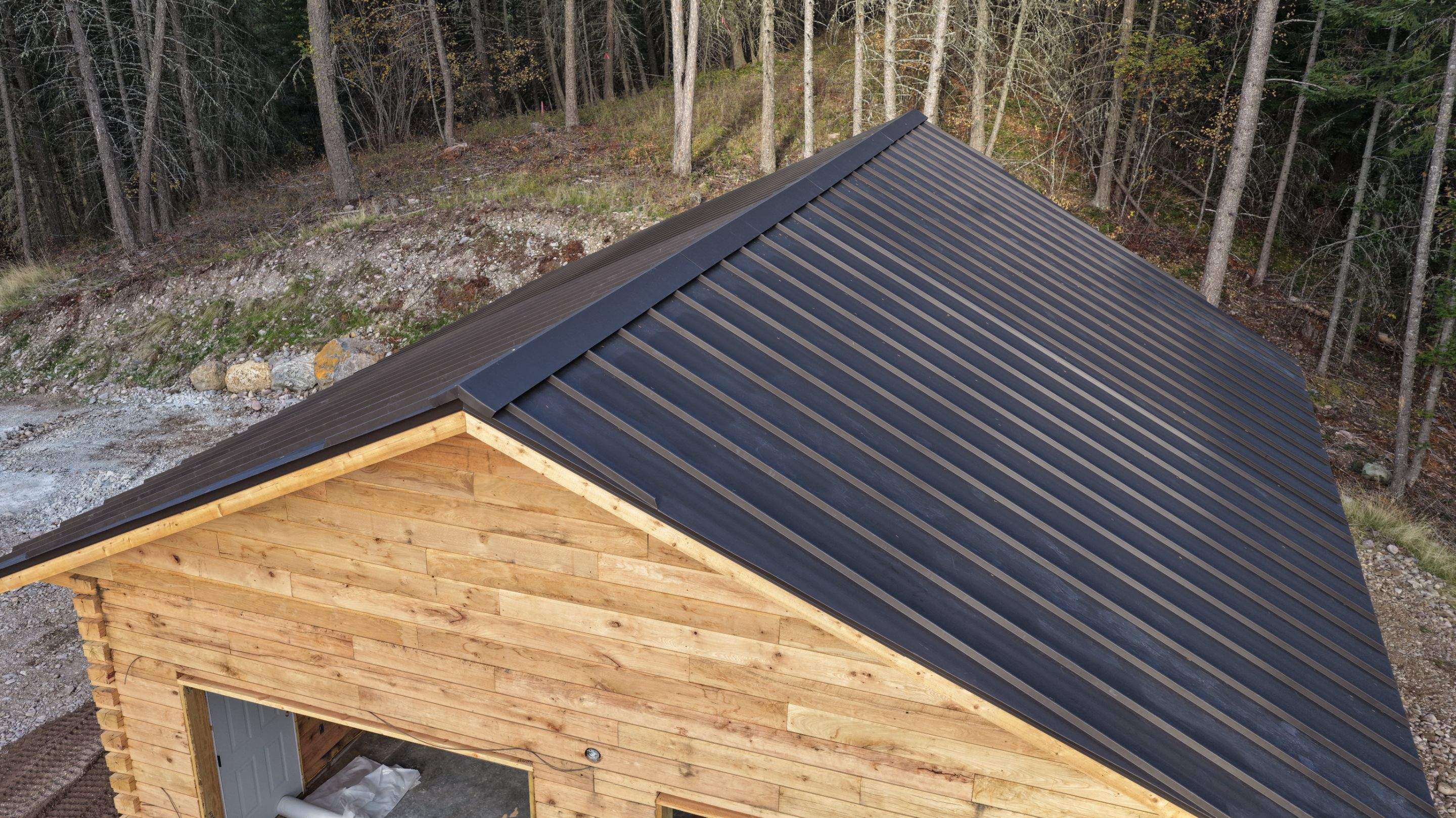 Mechanical Lock Standing Seam - CMG ULG Dark Bronze  by Montana Roofing Solutions
