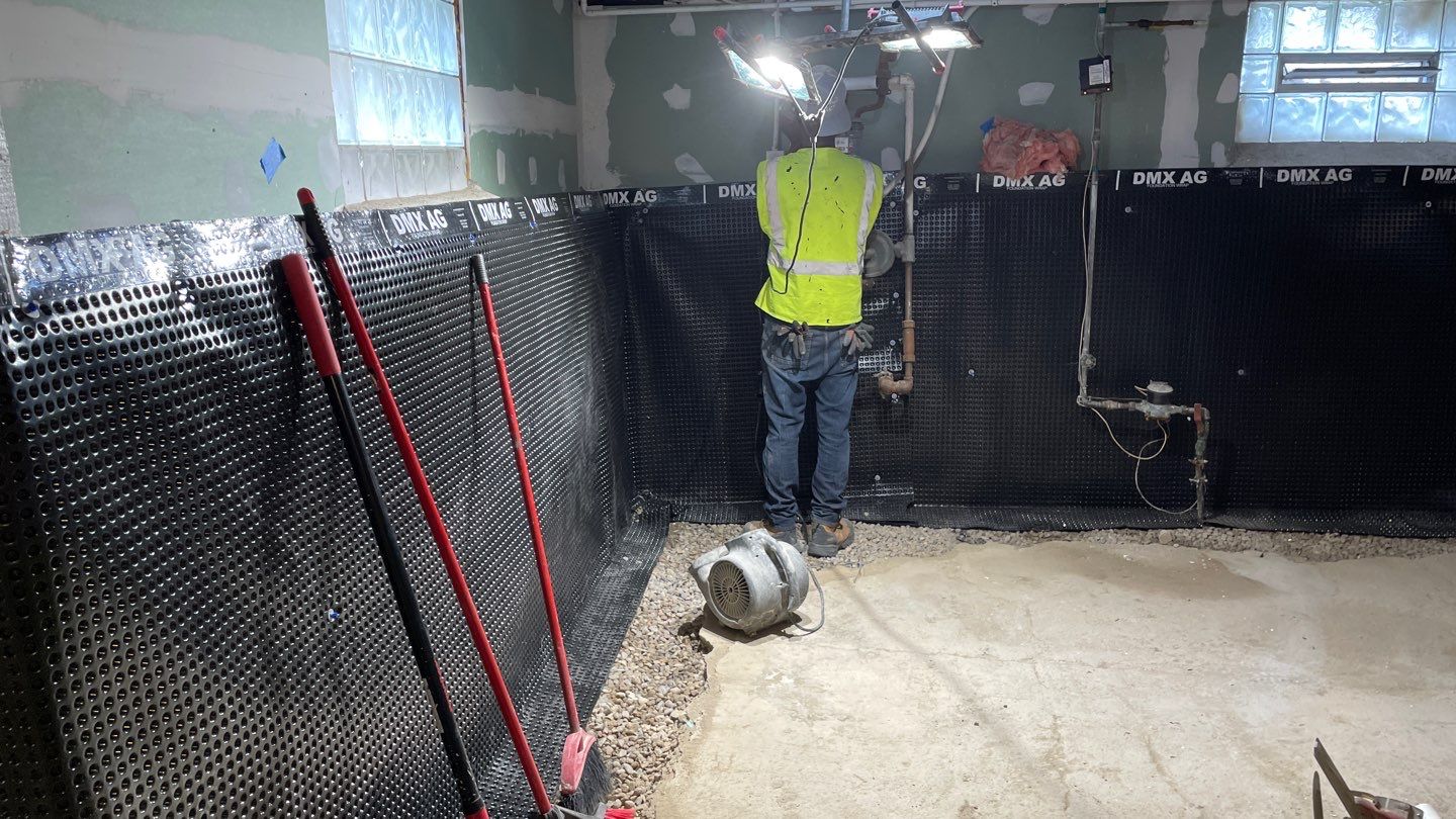 Drain Tile, Window Wells & Buried Discharge in Minneapolis by Waterproofing Northeast