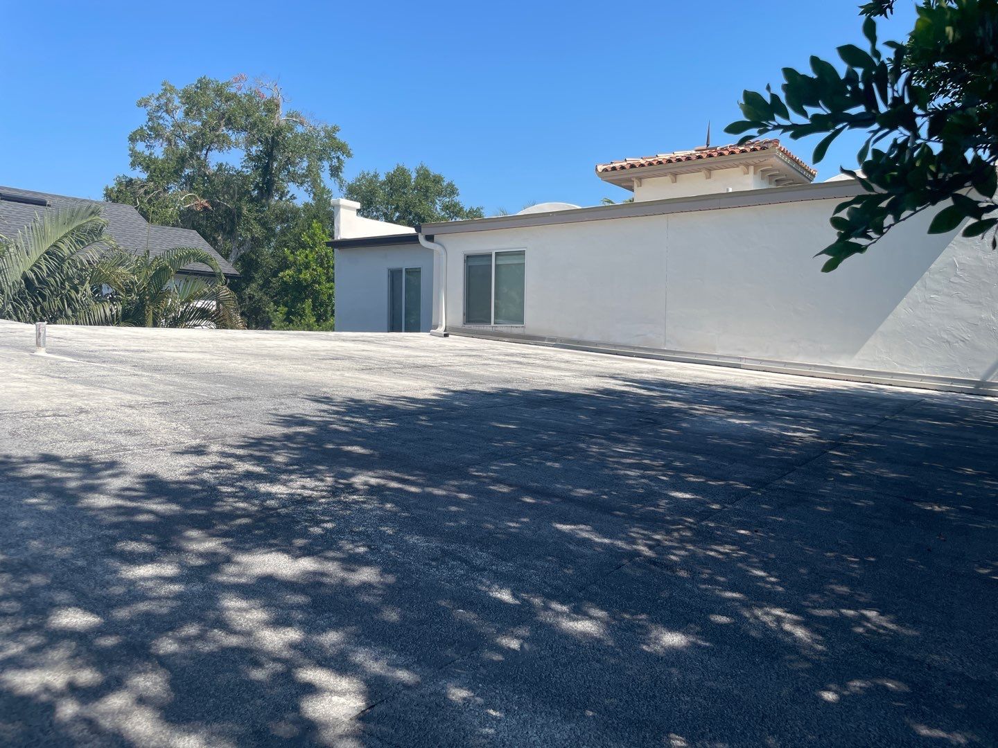 Residential Flat Roof Membrane and Tile Accents in Winter Park by Tip Top Roofing Co., Inc.
