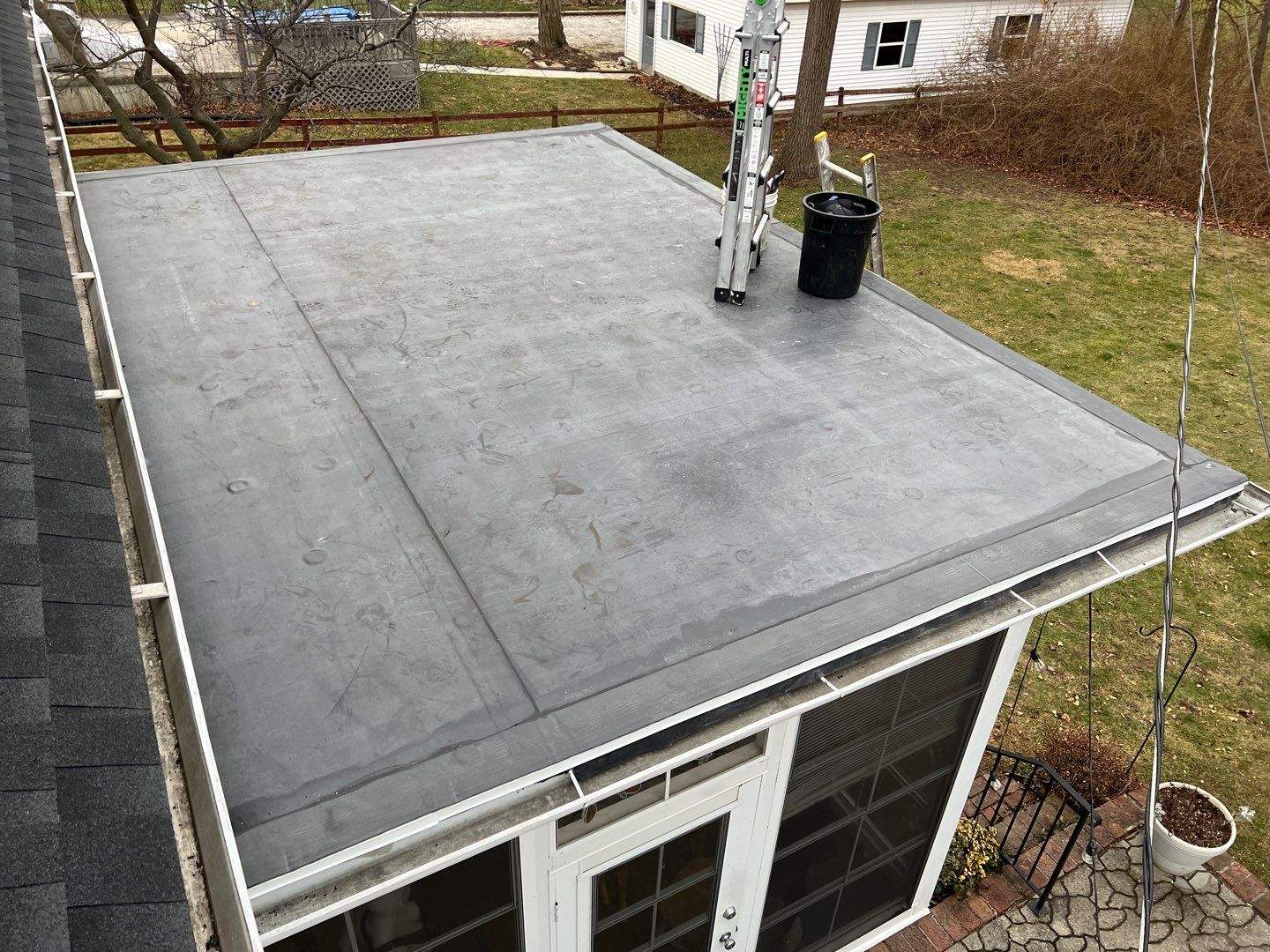 Residential Roofing Installation using 60 mil rubber roof by Nitro Roofing and Construction