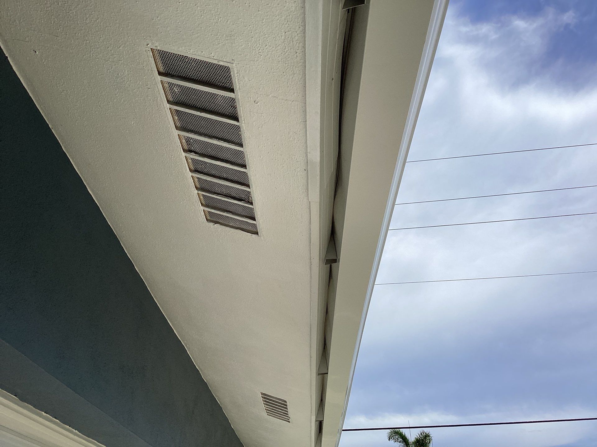 White Downspouts and Gutters Combo in Punta Gorda FL by Gutter Professors