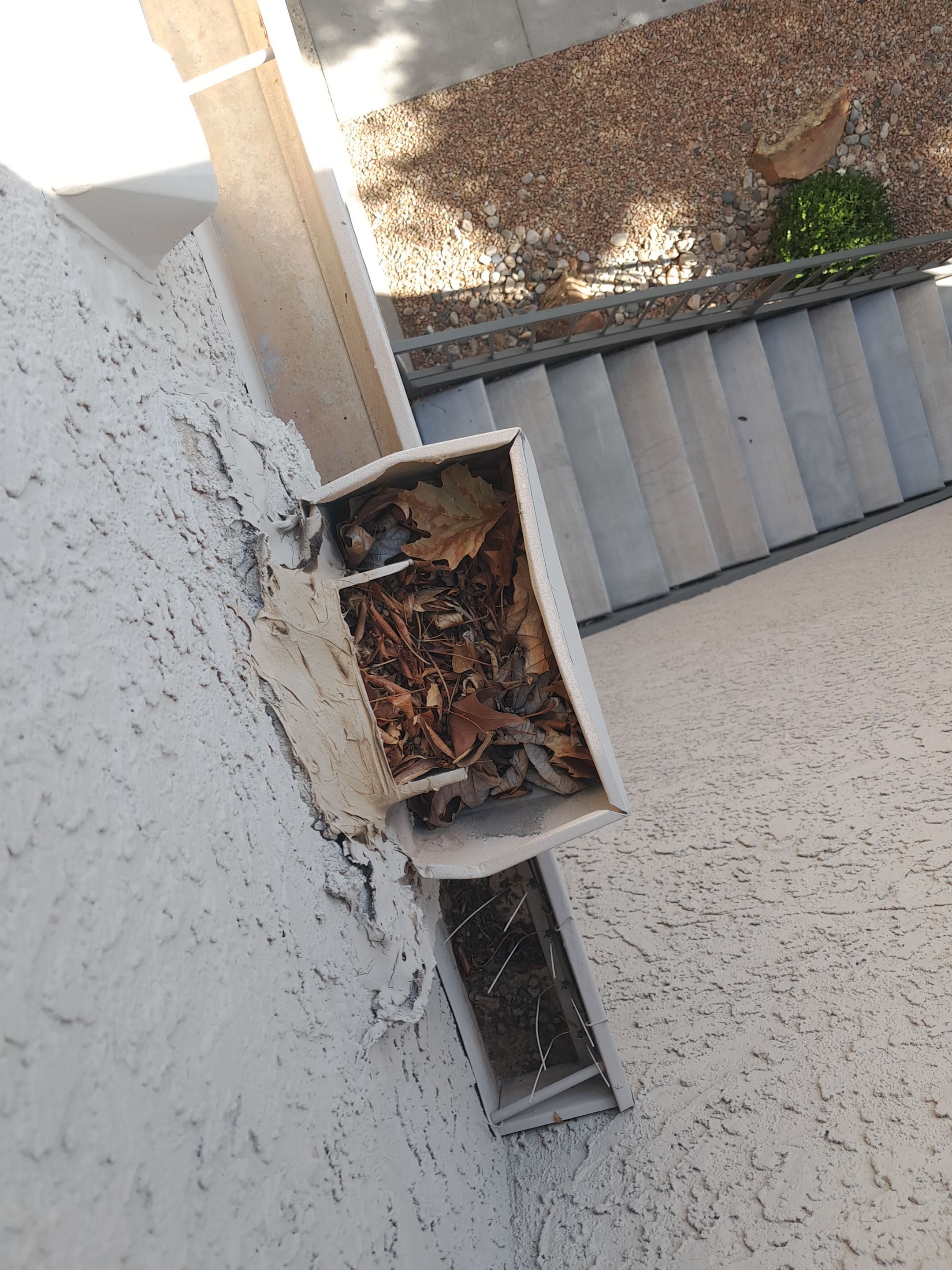 Commercial gutter cleaning Santa Fe, NM before photo with filled gutters